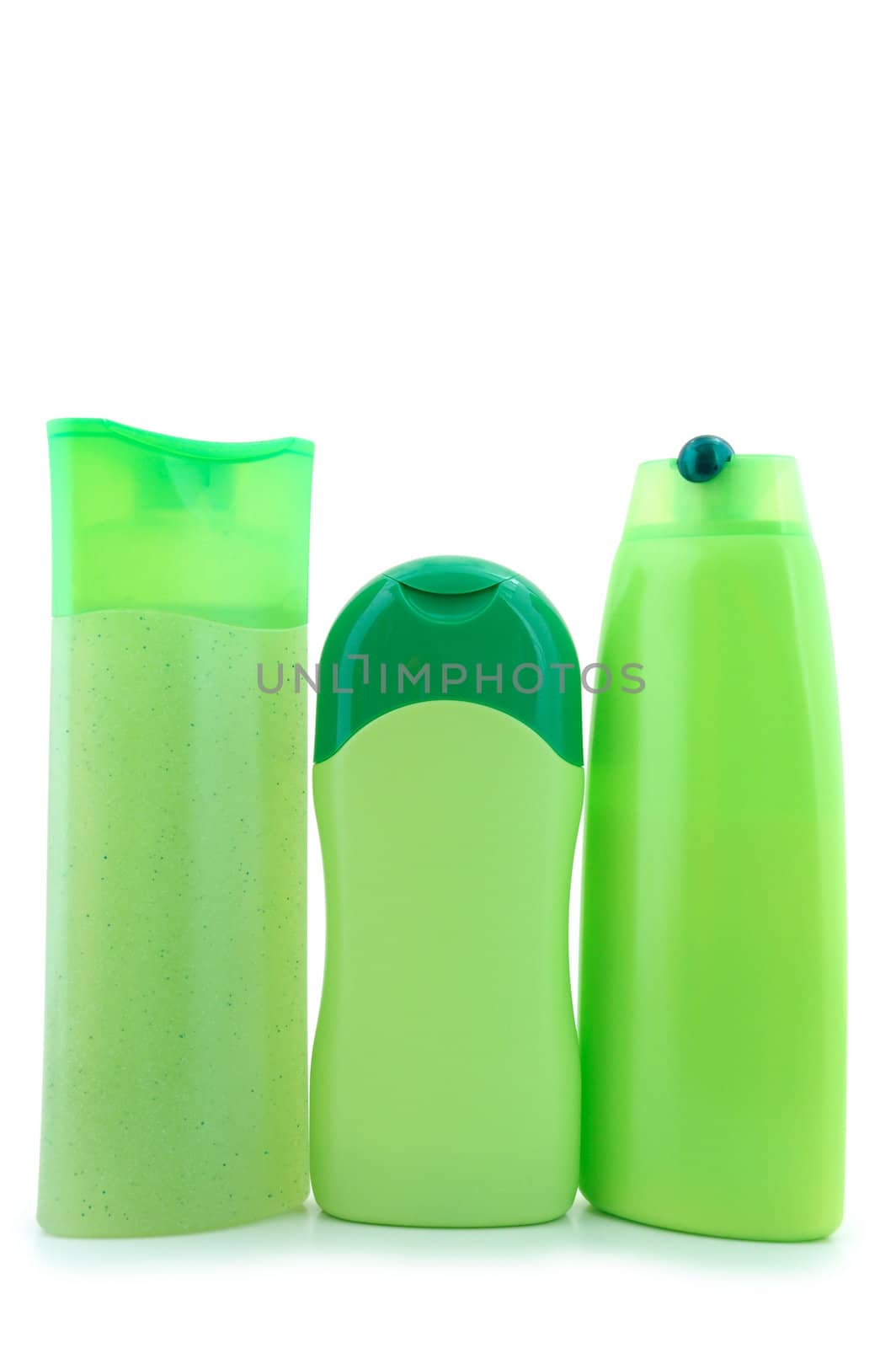 Three different  green beauty and hygiene products. On overwhite background.