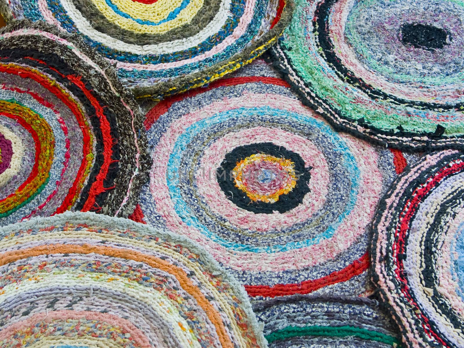 A background from several knitted doormats.