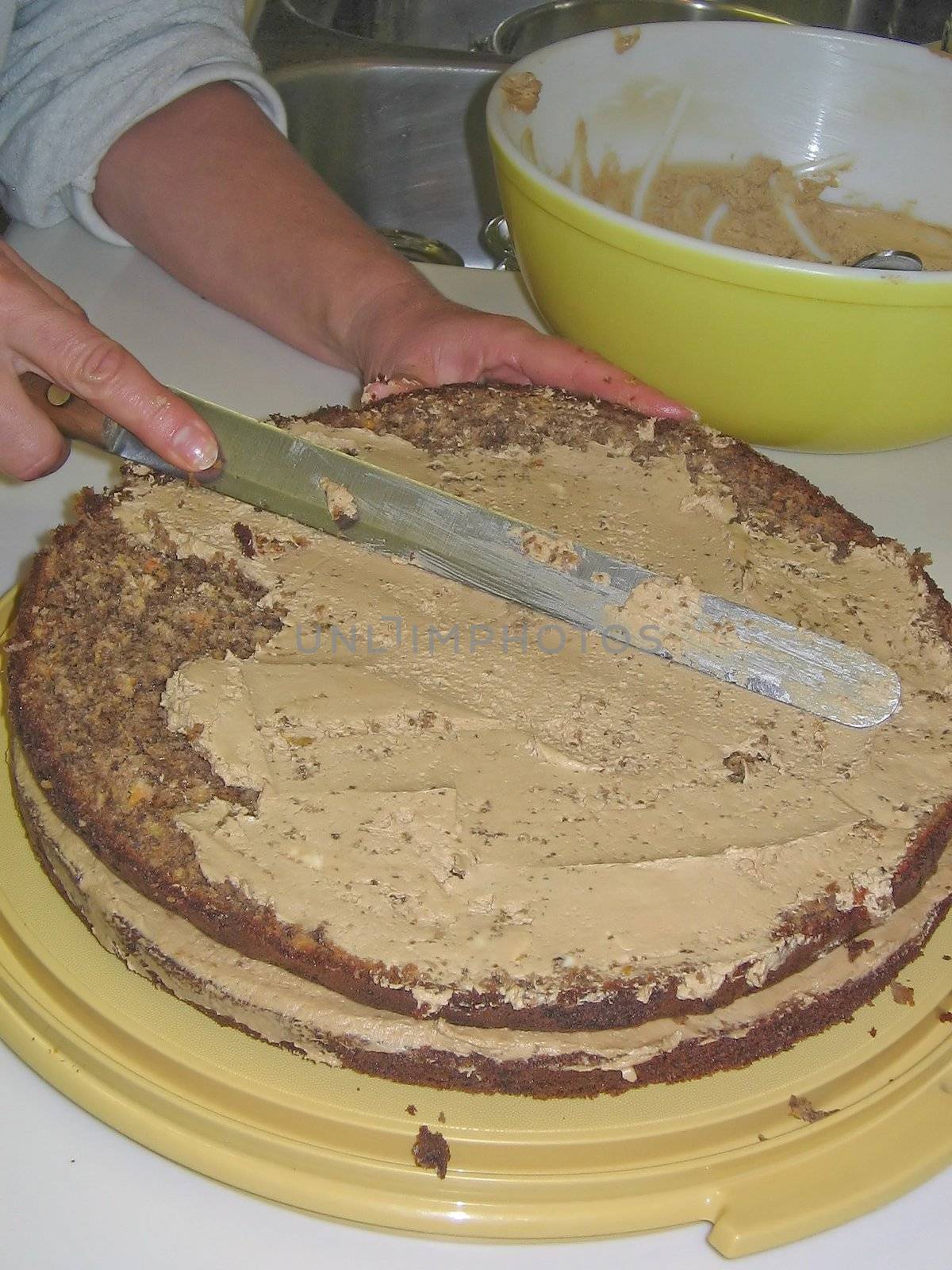 A layered walnut cake filled with walnut paste, orange jam and finished with buttercream, almonds and raspberrie