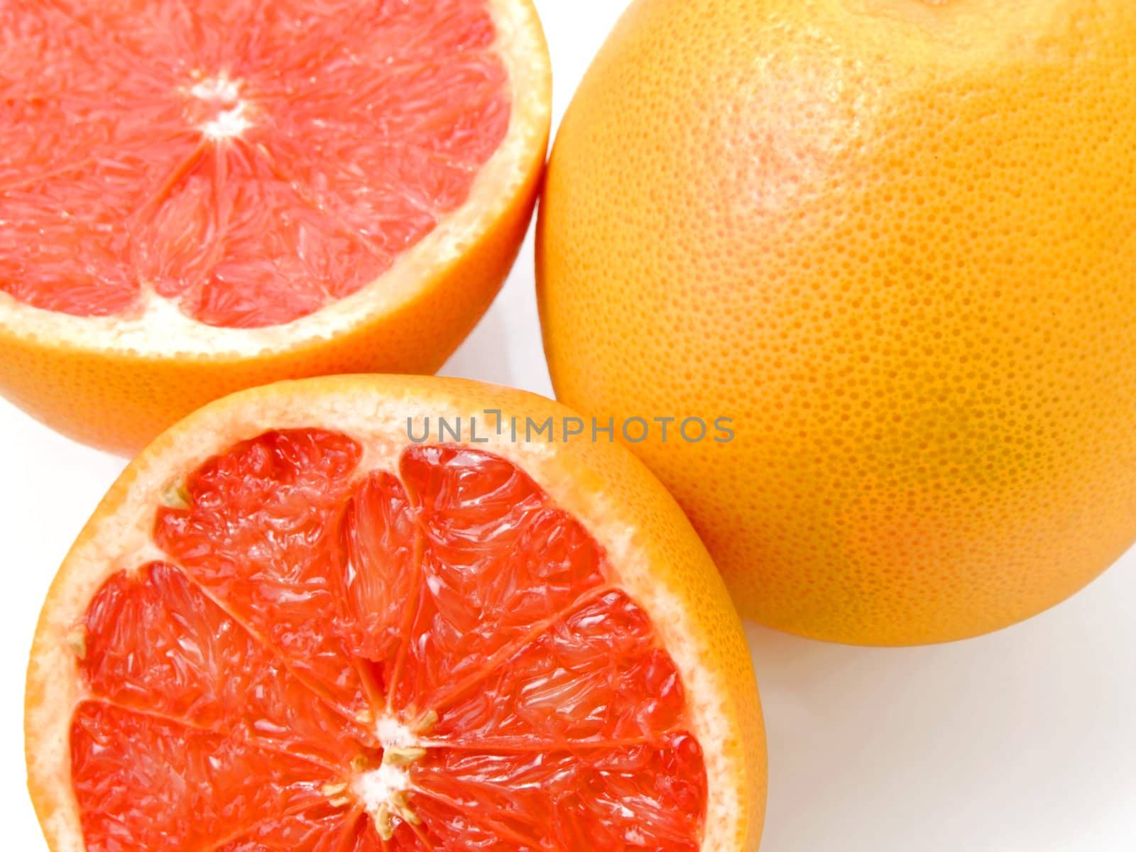 Close-up of a half cut ruby grapefruit