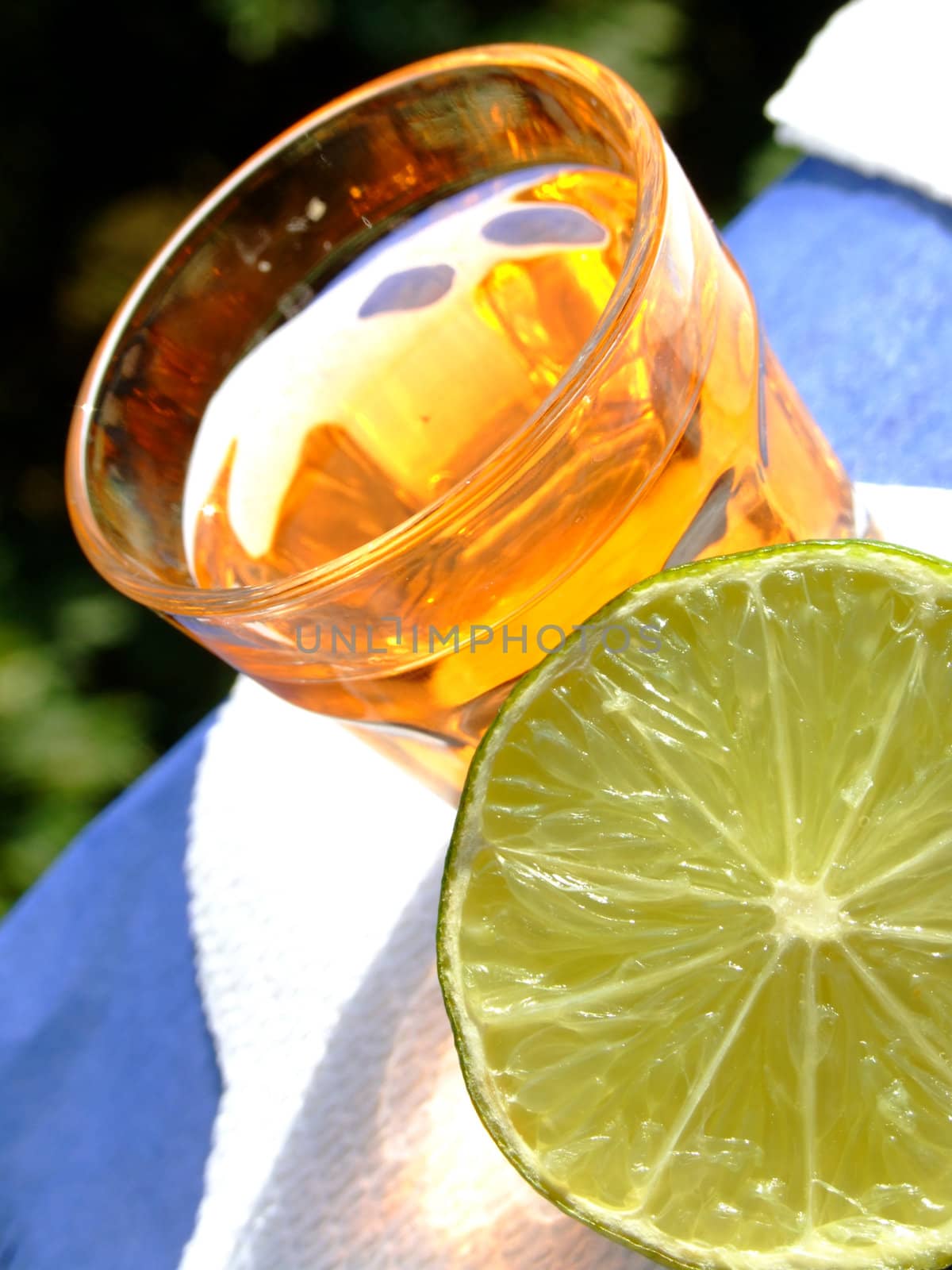 Close-up of a mini drink and a half cut lime
