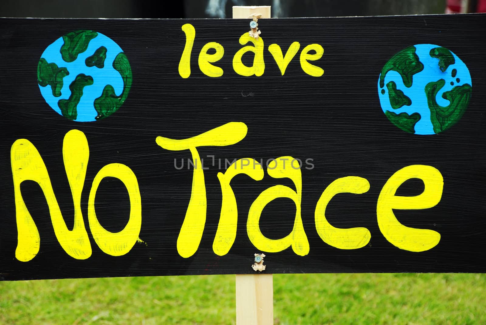 A hand-painted sign reading 'Leave No Trace', as an environmental message against leaving litter
