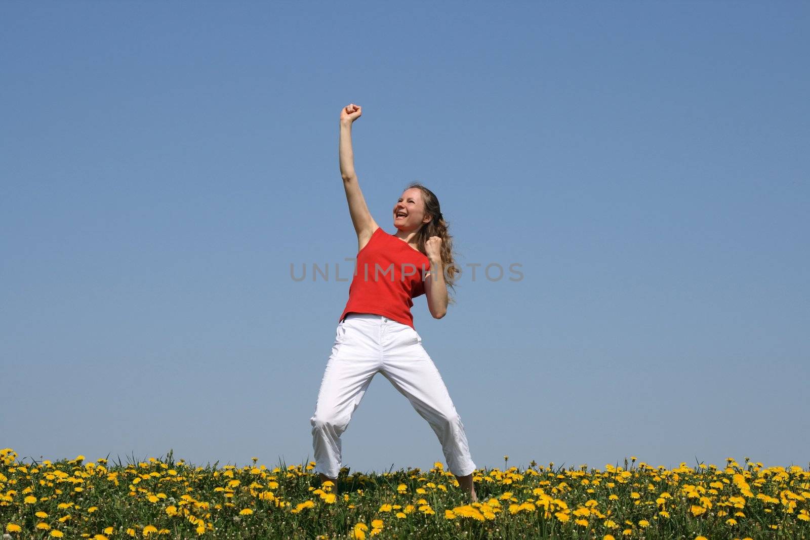 Winner concept. Young woman yelling "yeah!" in joy.