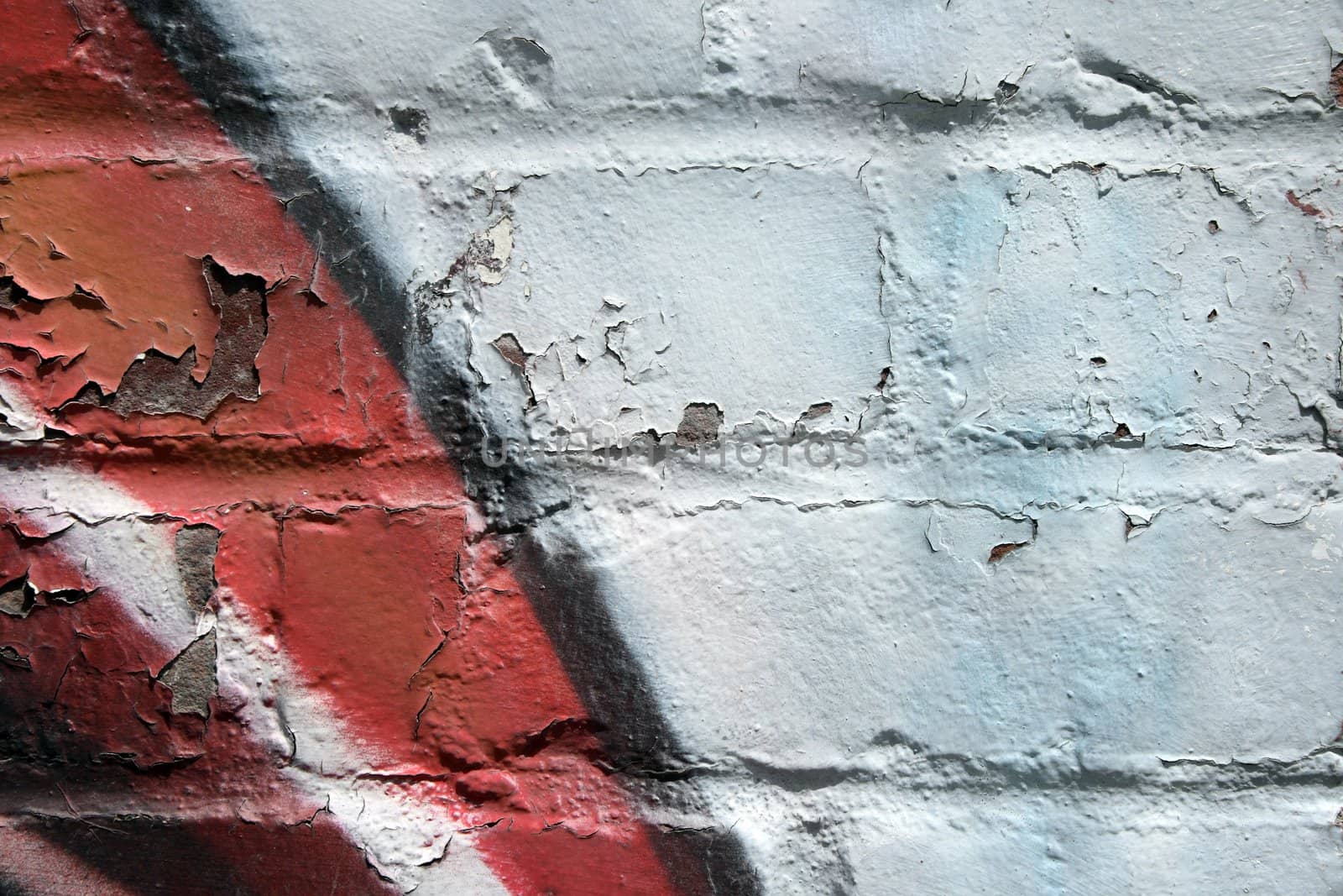 Graffiti on a peeling brick wall by anikasalsera