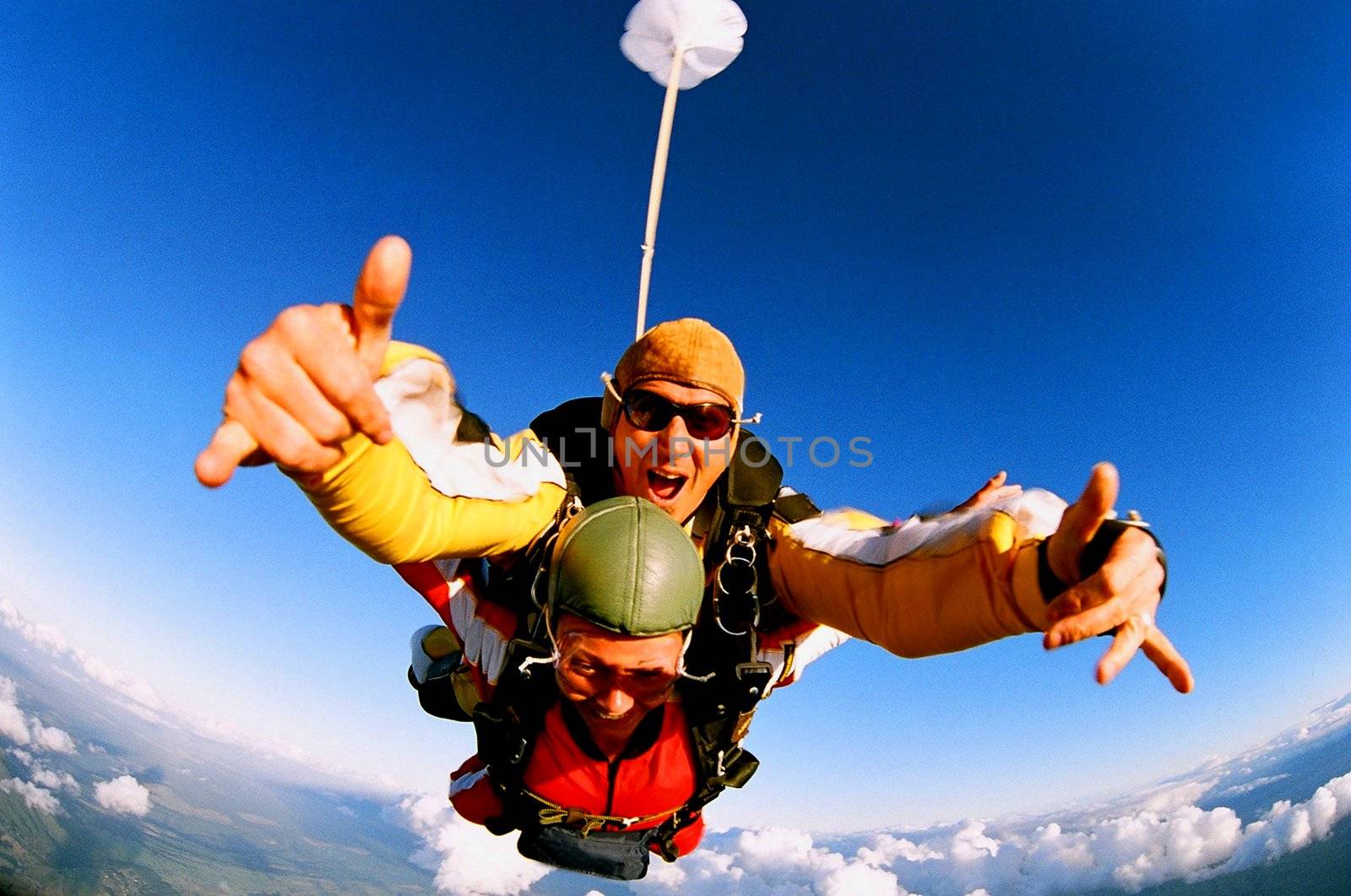 Tandem skydiver in action parachuting.