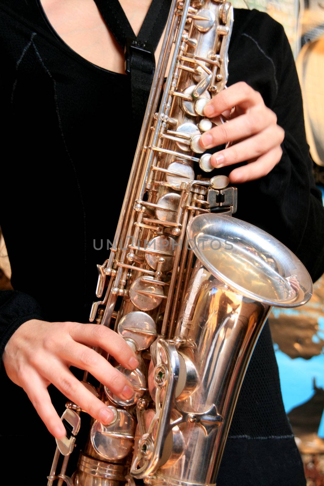 hands of musicinan playing Saxophone