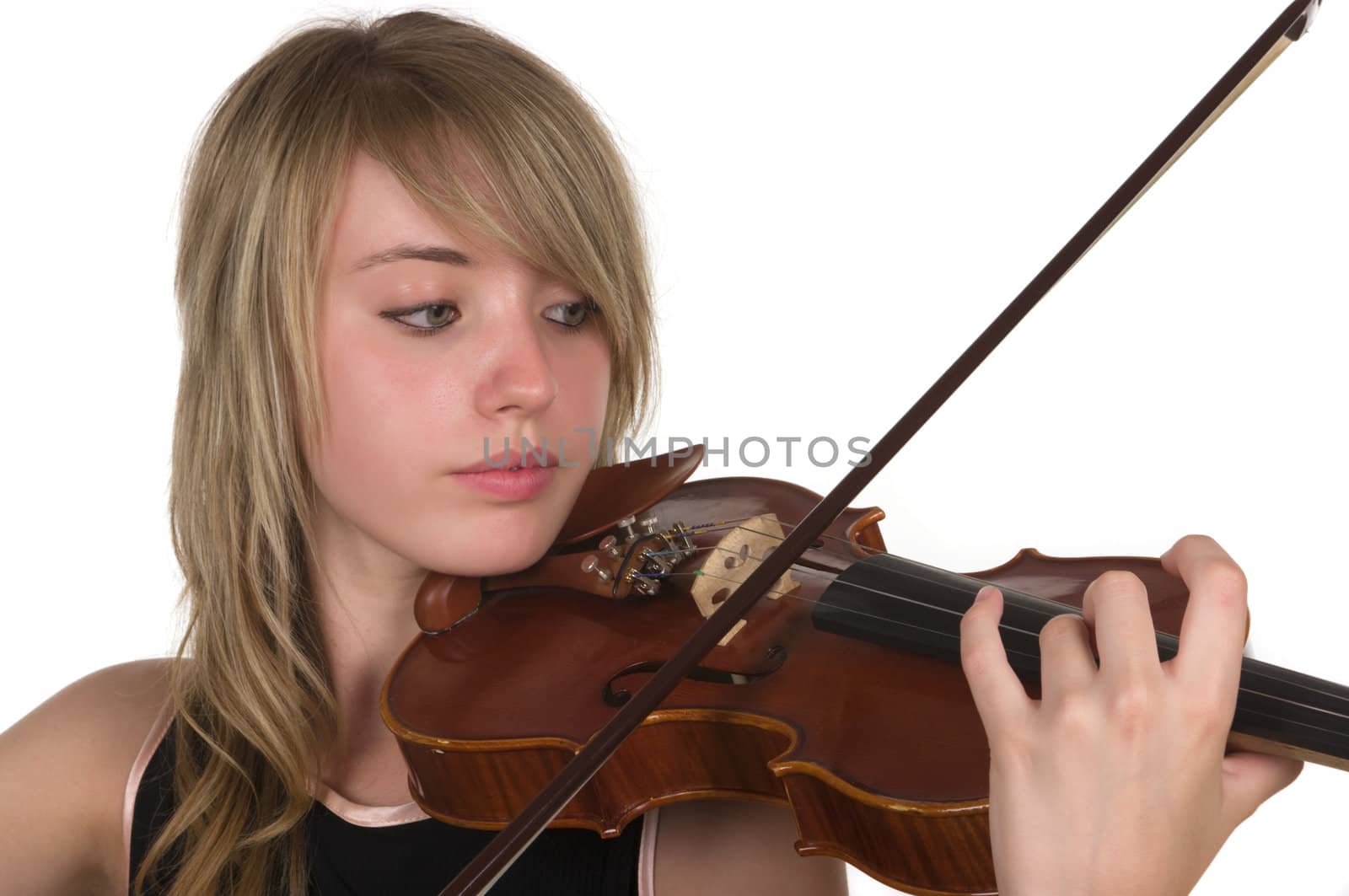 A beautiful young teenager playing her violin