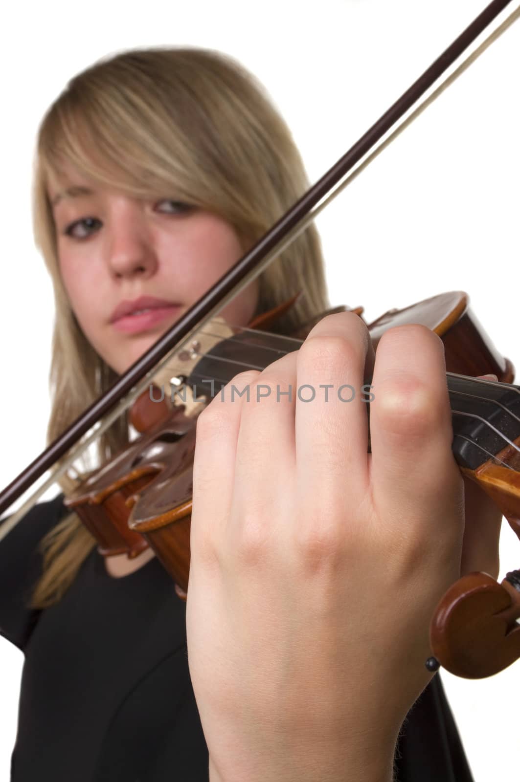 A beautiful teenager playing her violin
