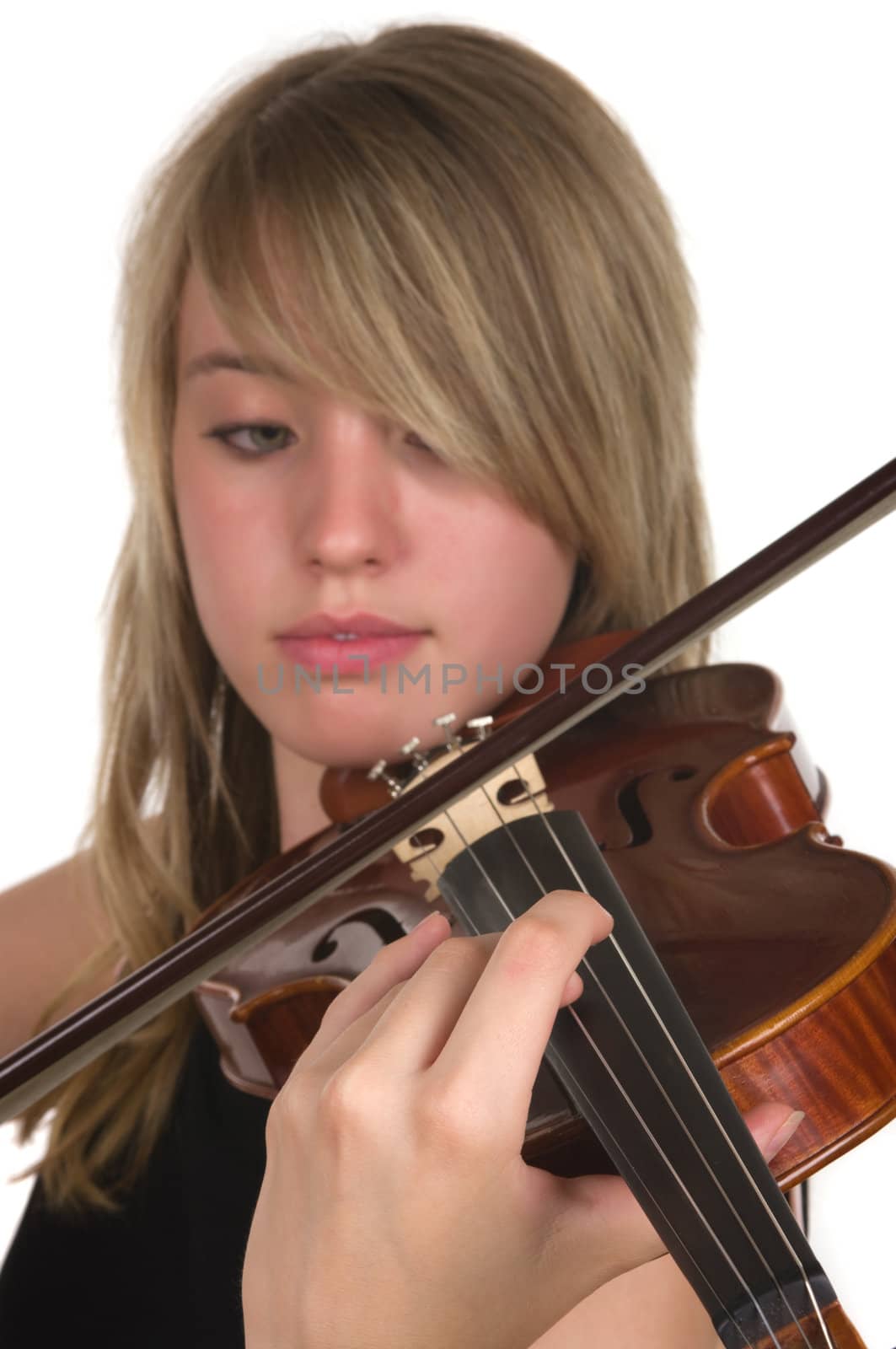 A beautiful teenager playing her violin