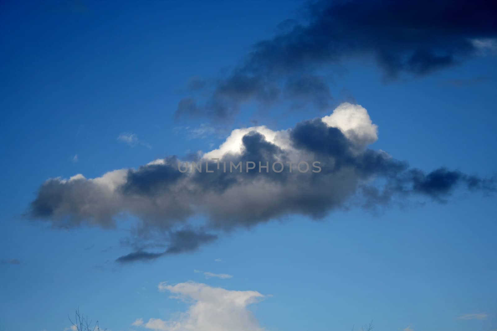 Dark blue sky with white clouds 2