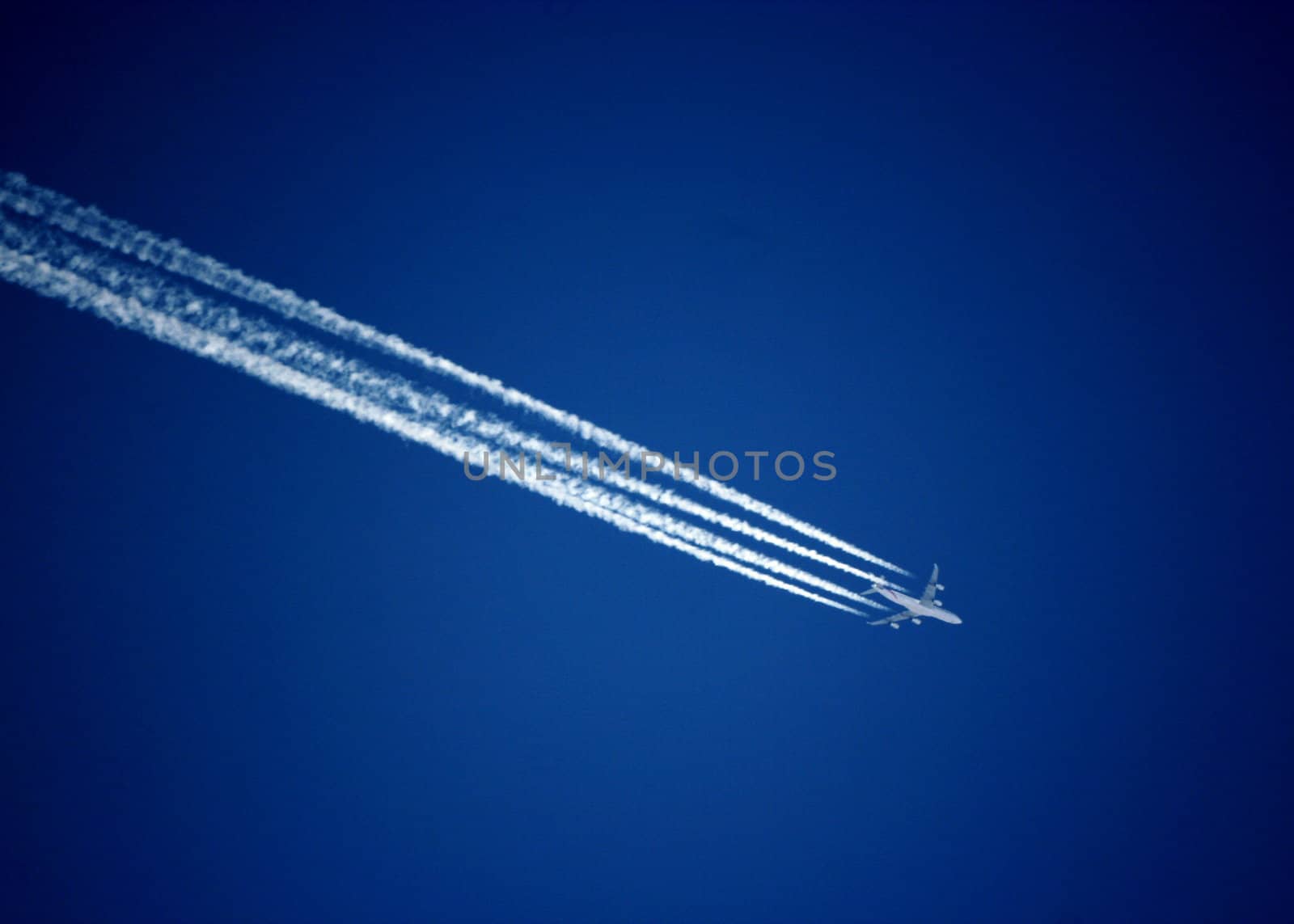Trace of the plane on the blue sky background