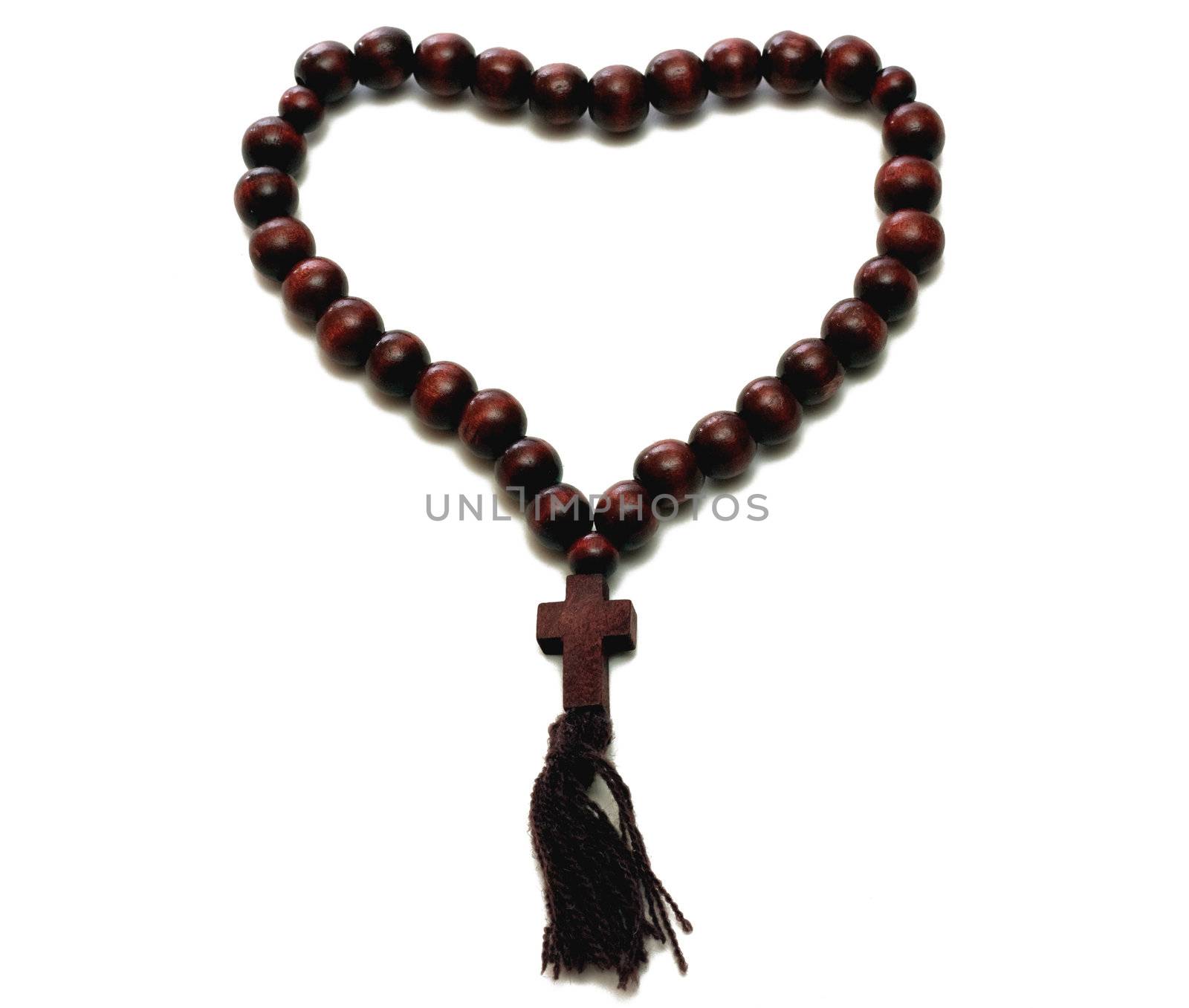 Wood rosary isolated over white background