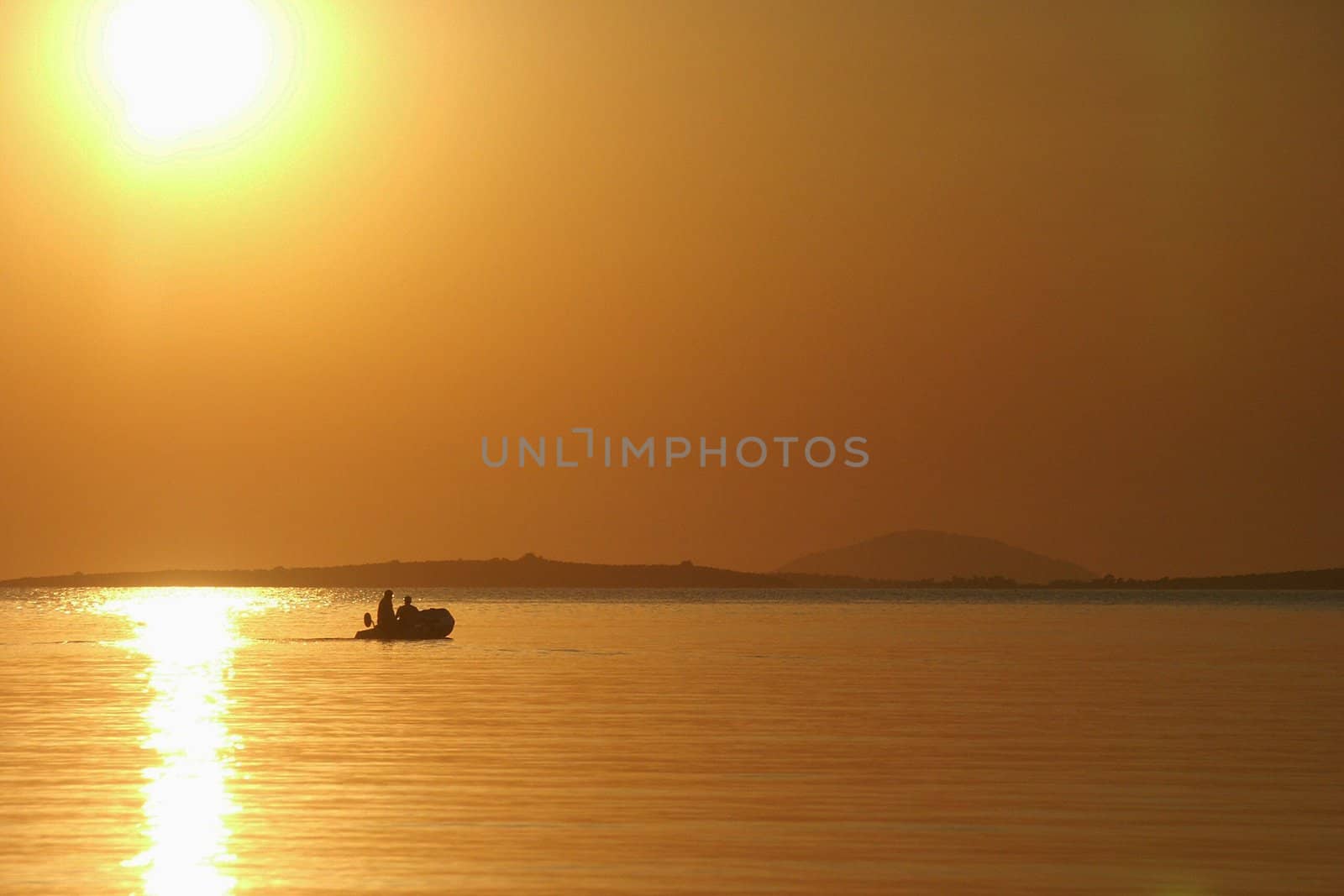 beautiful sunset above greece sea with bout, horizontally framed shot