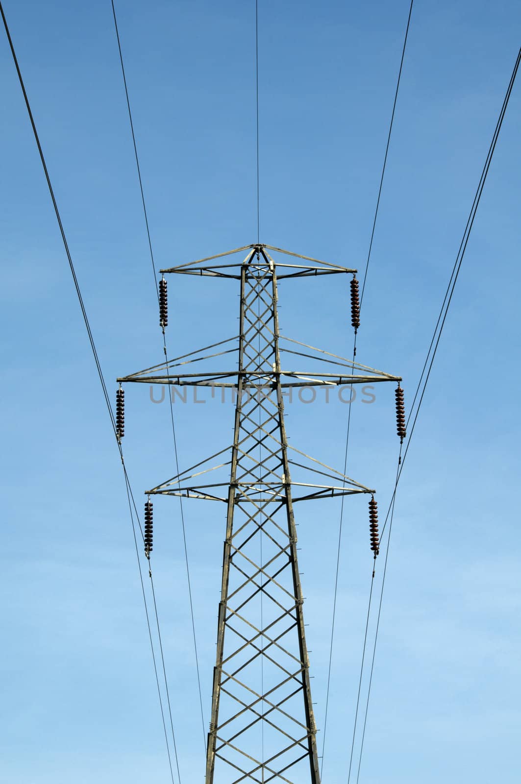 A electrical pylon with a blue sky