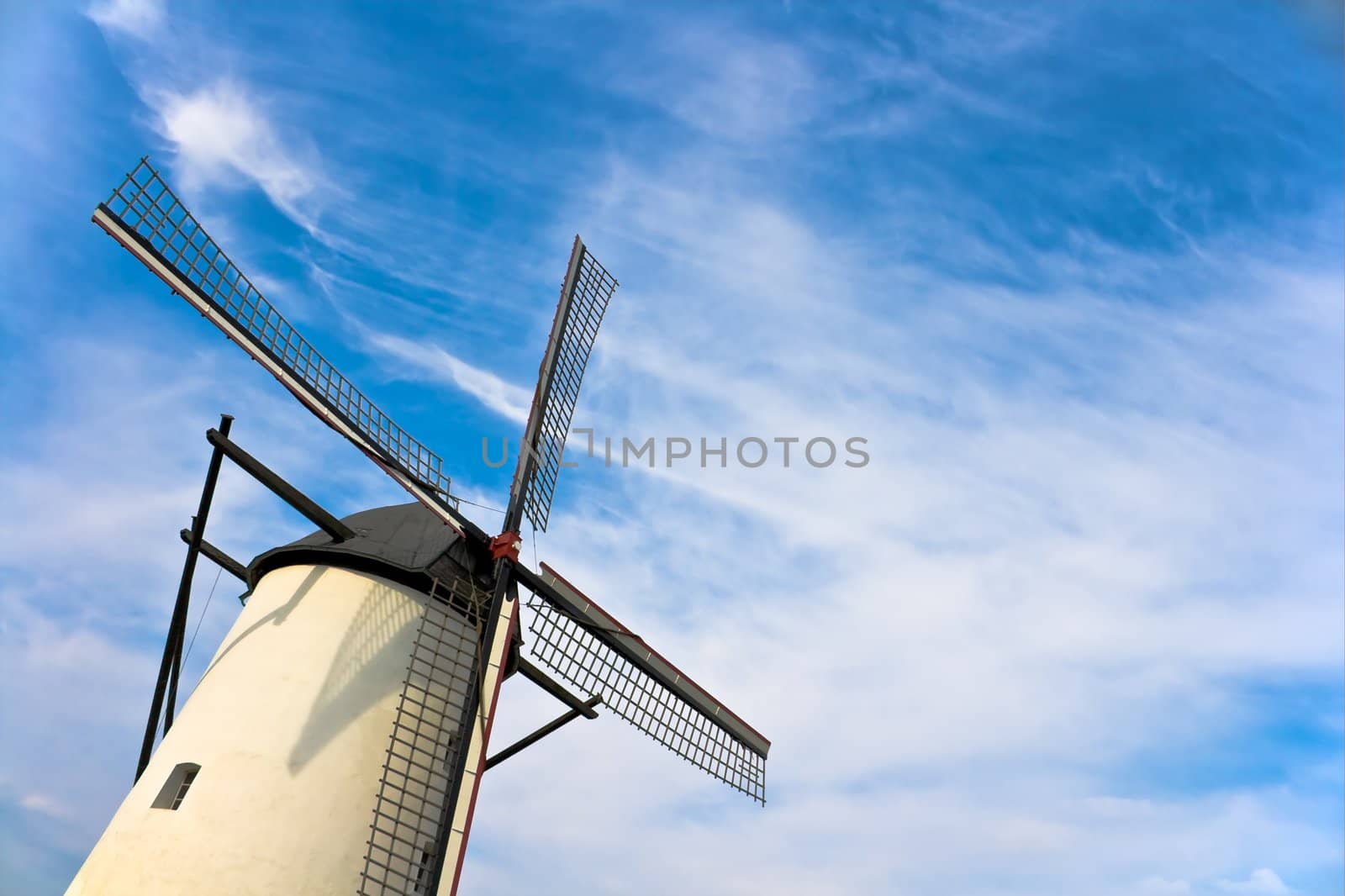 Windmill against nice blue sky