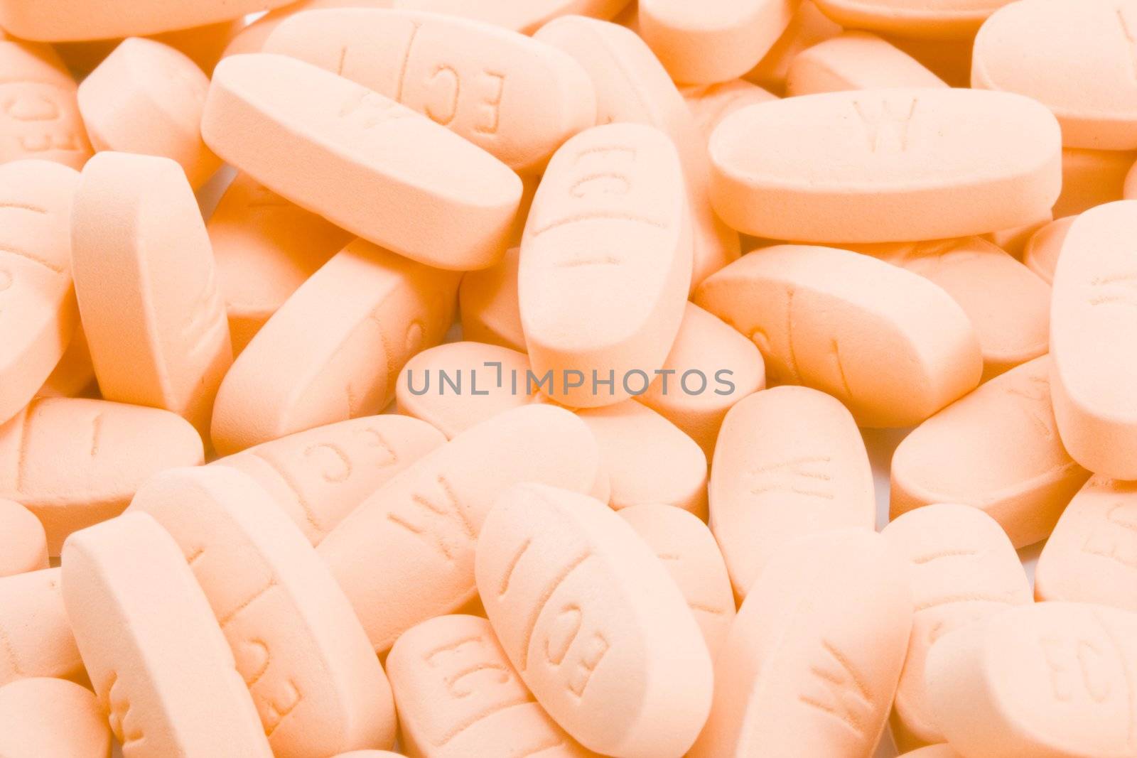 a ton of pills - orange pills - drugs
