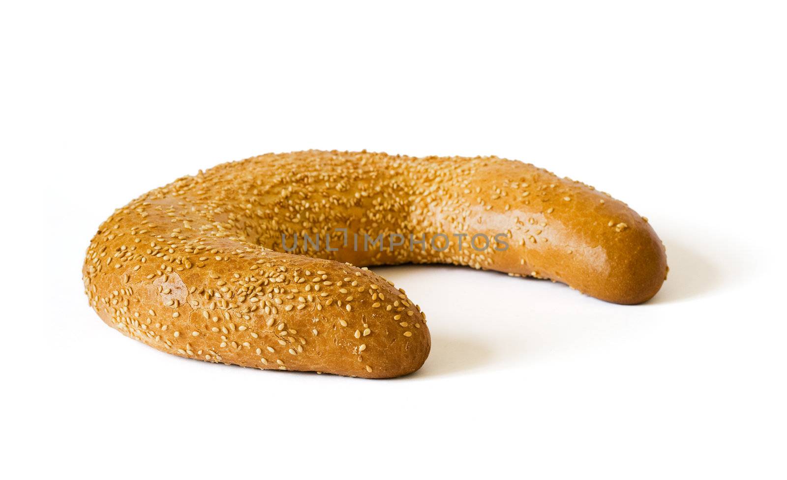 Isolated white bread with sesame and shadow on white background. Clipping path included to remove object shadow or replace background.