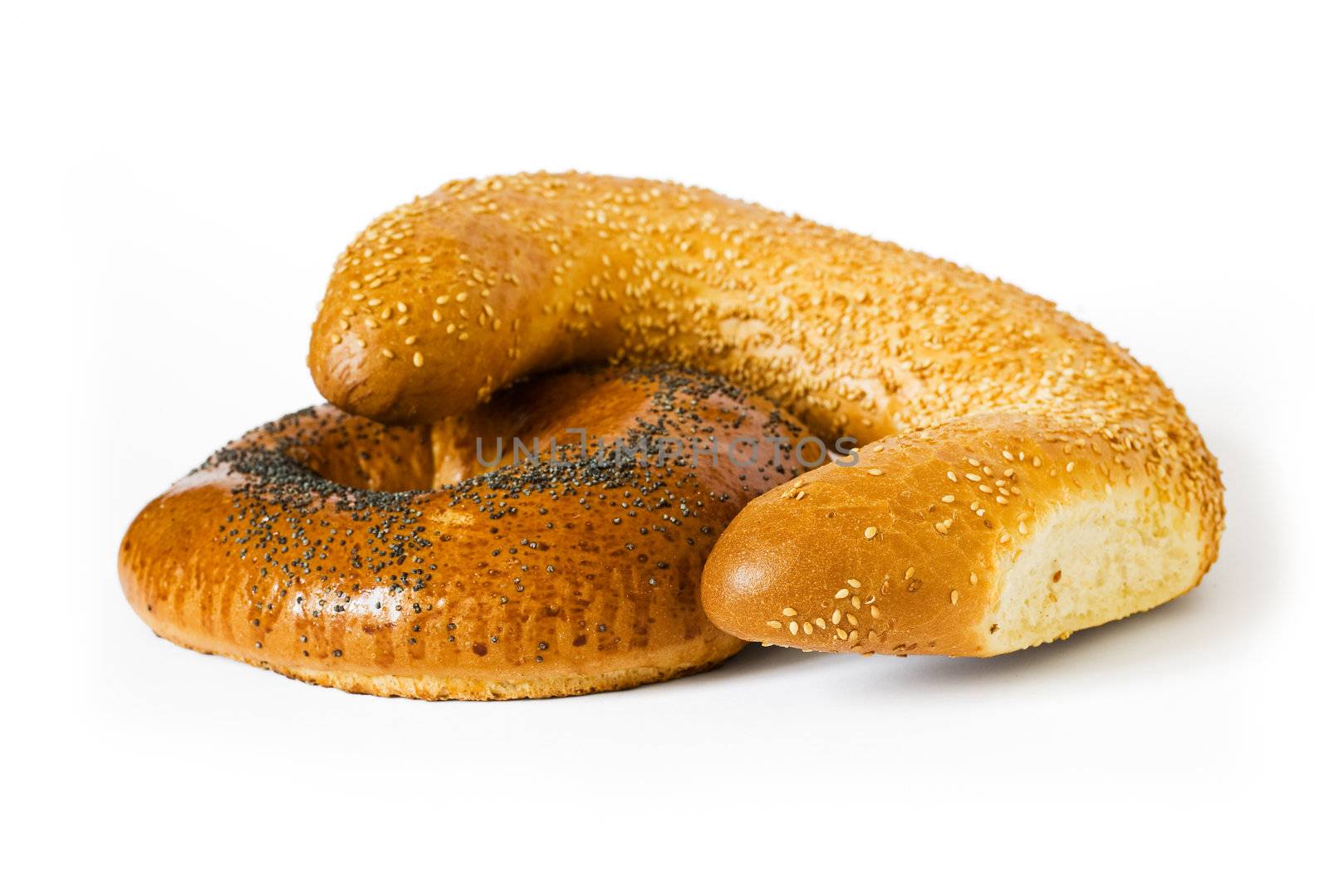 Isolated white bread with poppy and sesame seeds. Objects with shadow on white background. Clipping path included to remove object shadow or replace background.