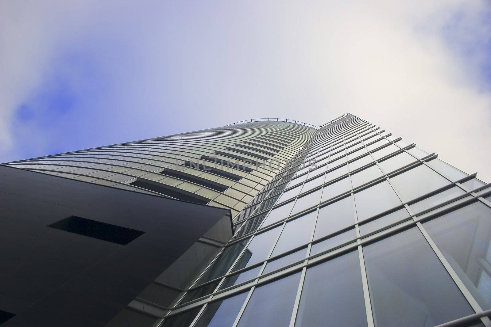 Office building Skyscraper on cloudy sky from low angle