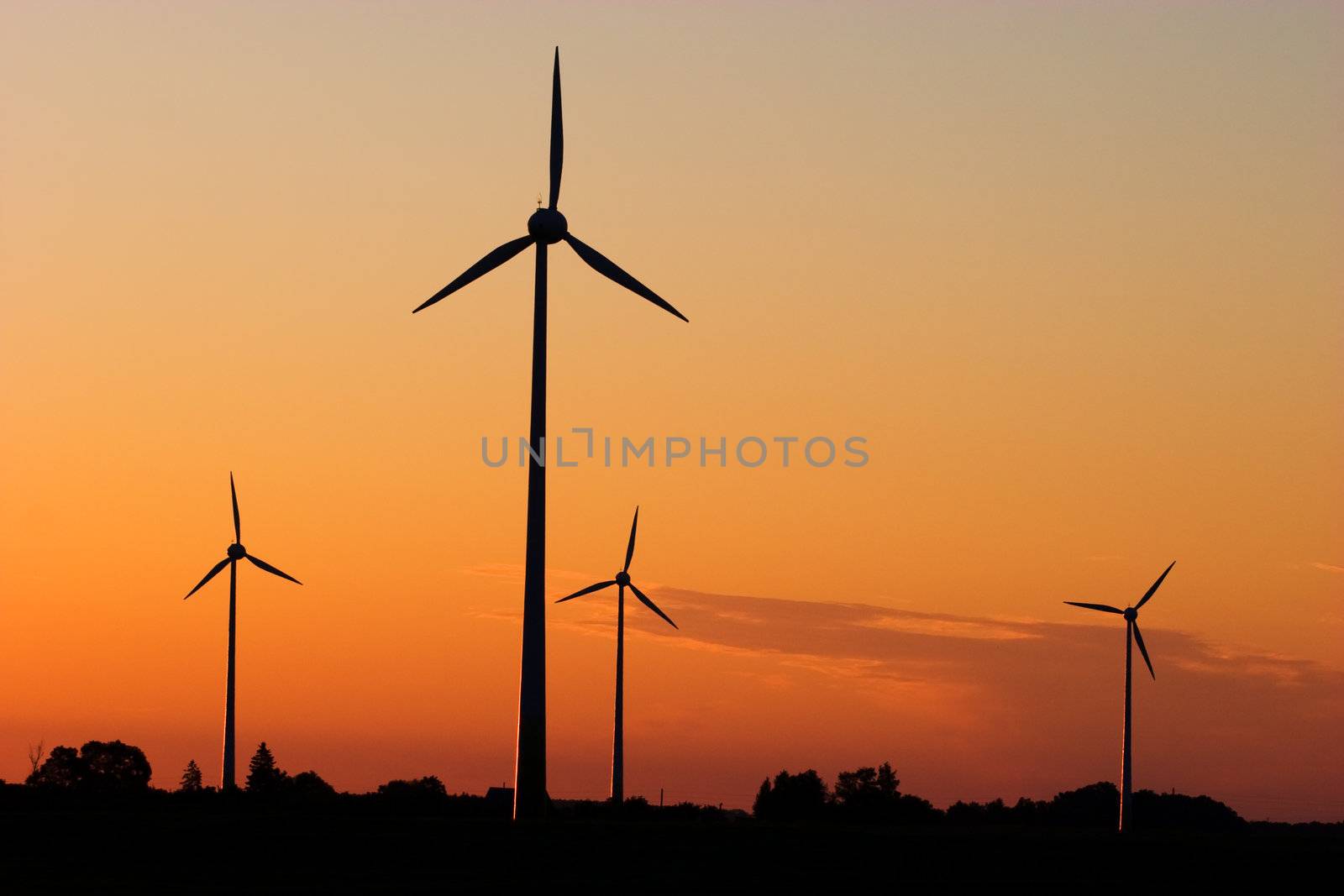 Wind generators in sunrise by ints
