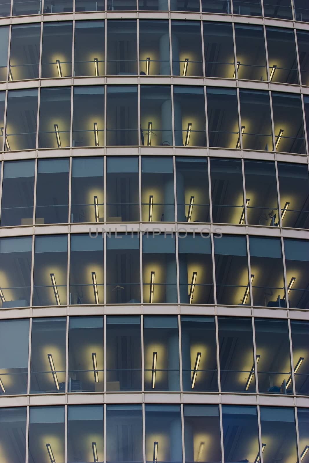 Illuminated windows of corporate office building.