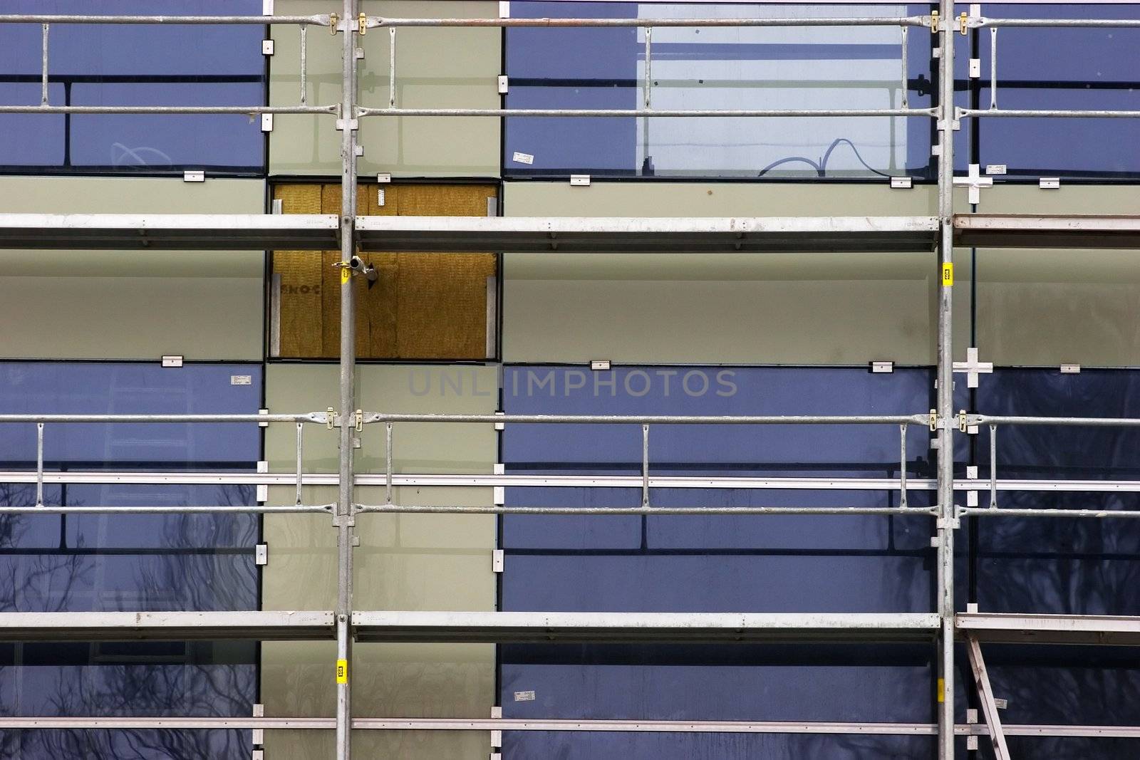 Detail of scaffolding platform infront of new house facade