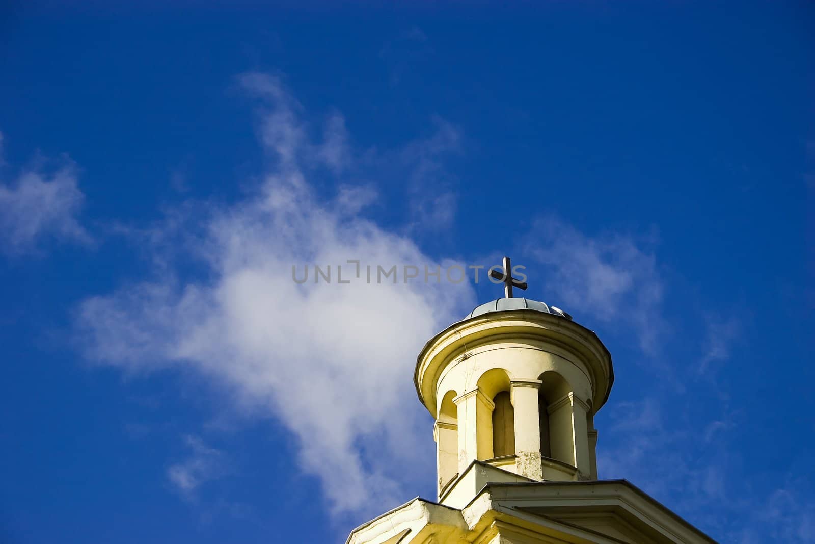 Church tower on blue sky by ints