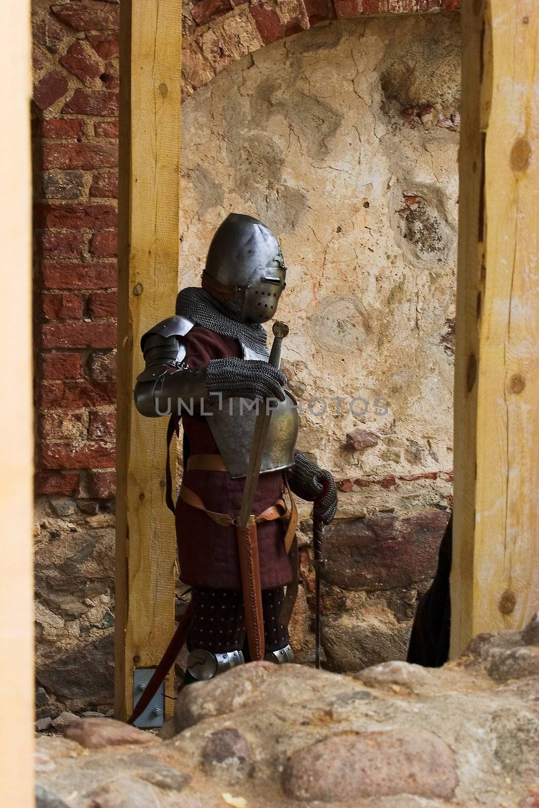 Armoured knight with sword in medieval festival after batle