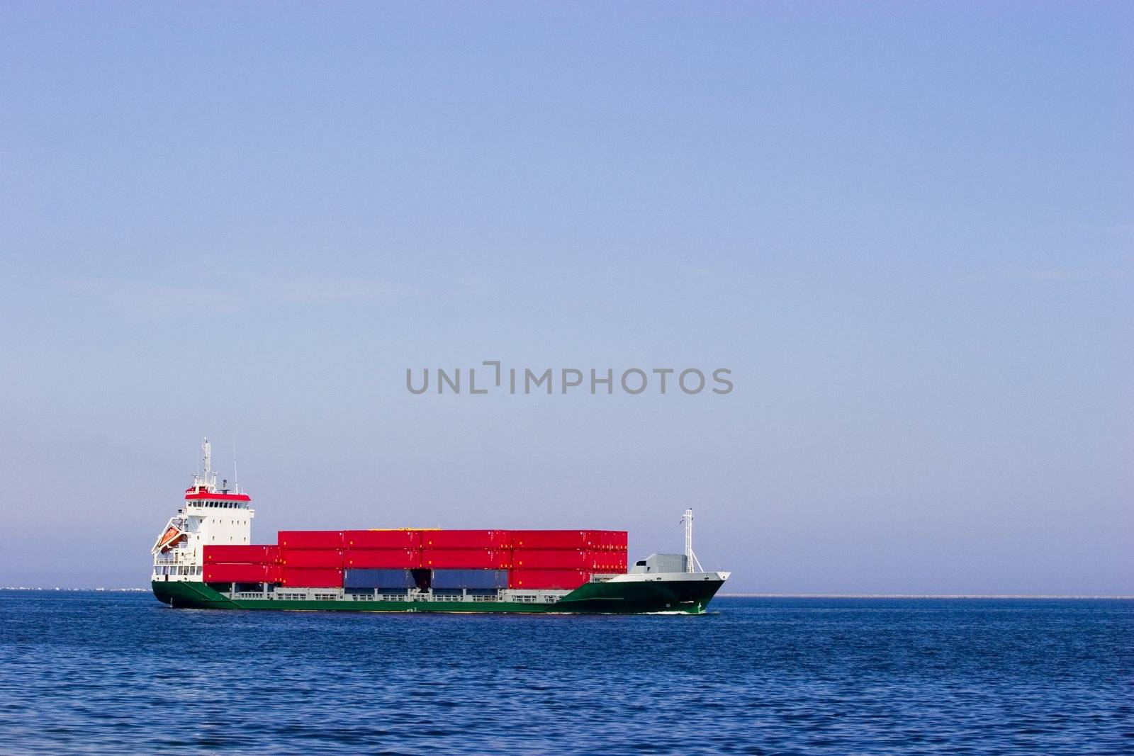 Cargo ship with red containers by ints