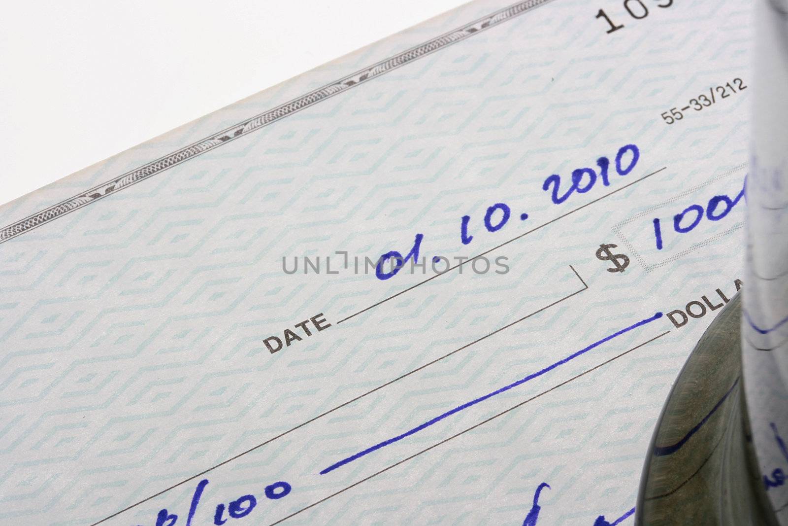 The check for payment with a shooting foreshortening for the sum and date.