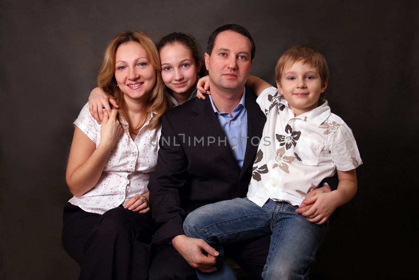 Portrait of parents and children in studio