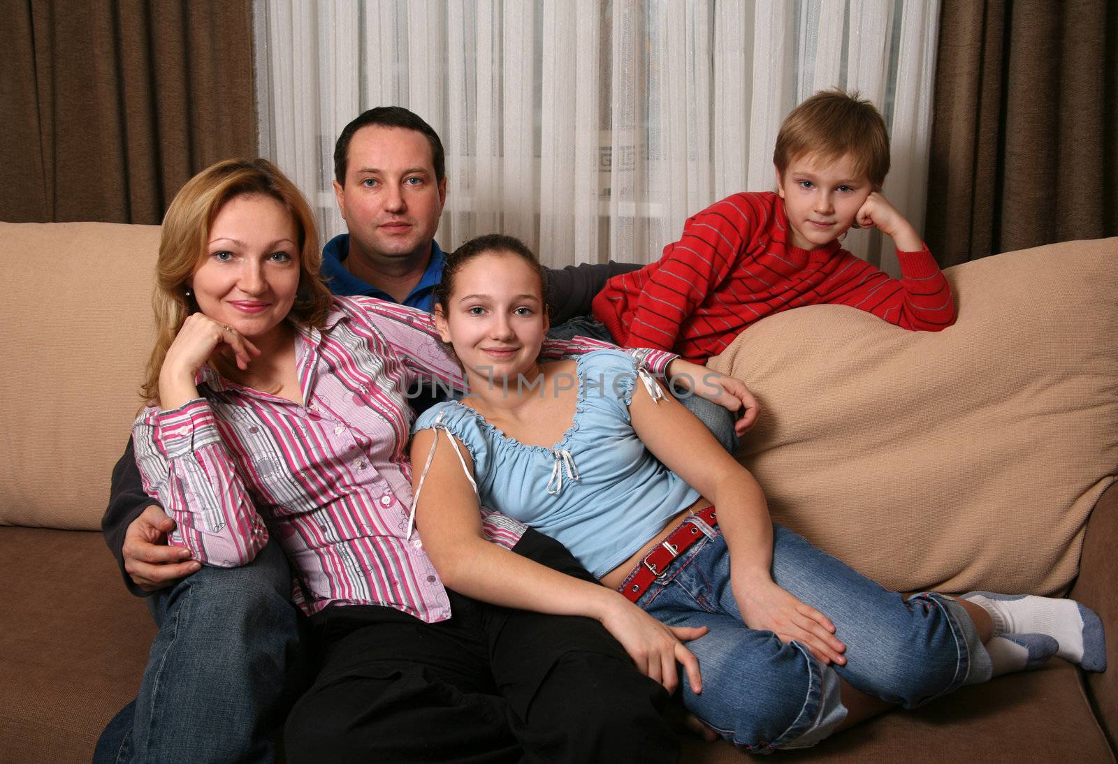 Portrait of parents and children at home