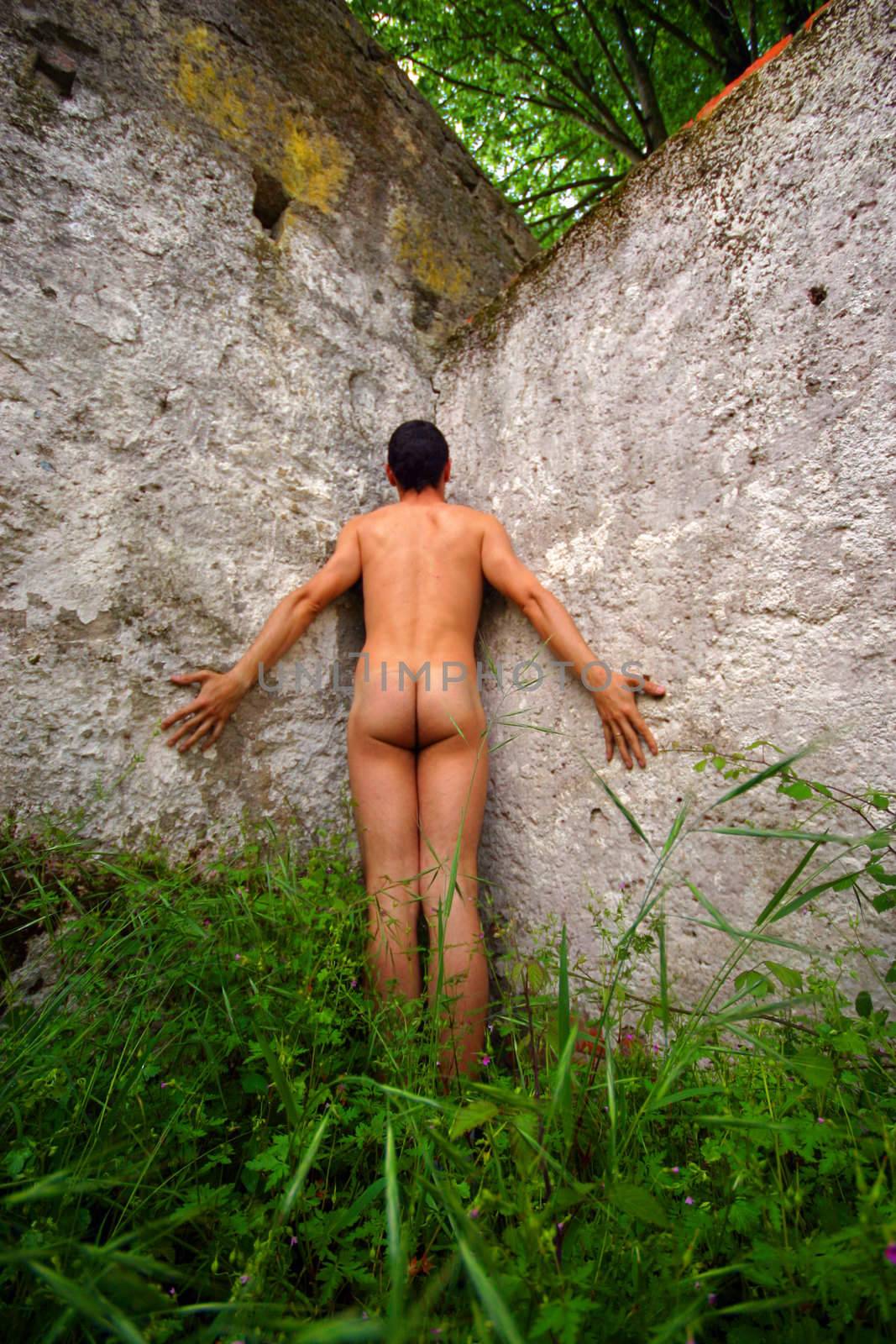 naked and alone man in old building