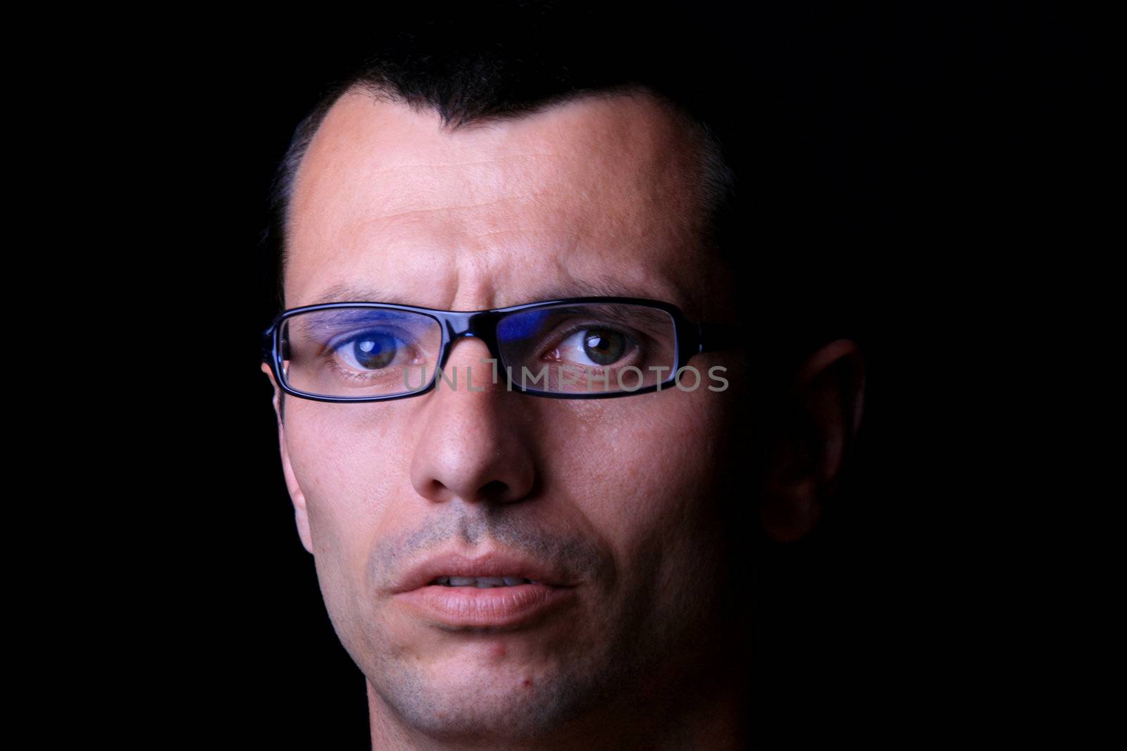young man over black background