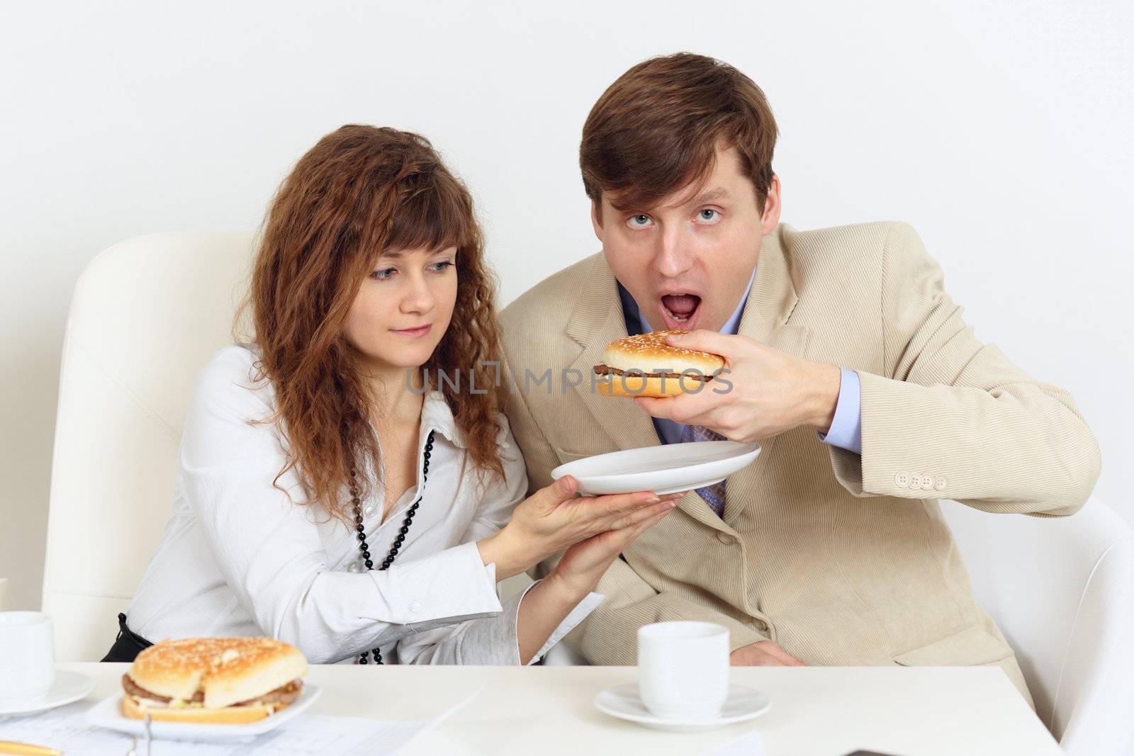 A pair of businessmen lunching in the workplace