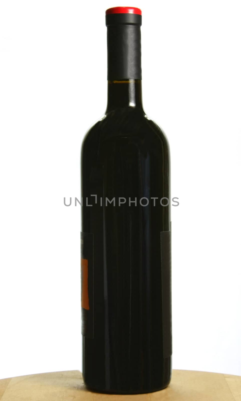 Single bottle of dark red wine by jayvivid