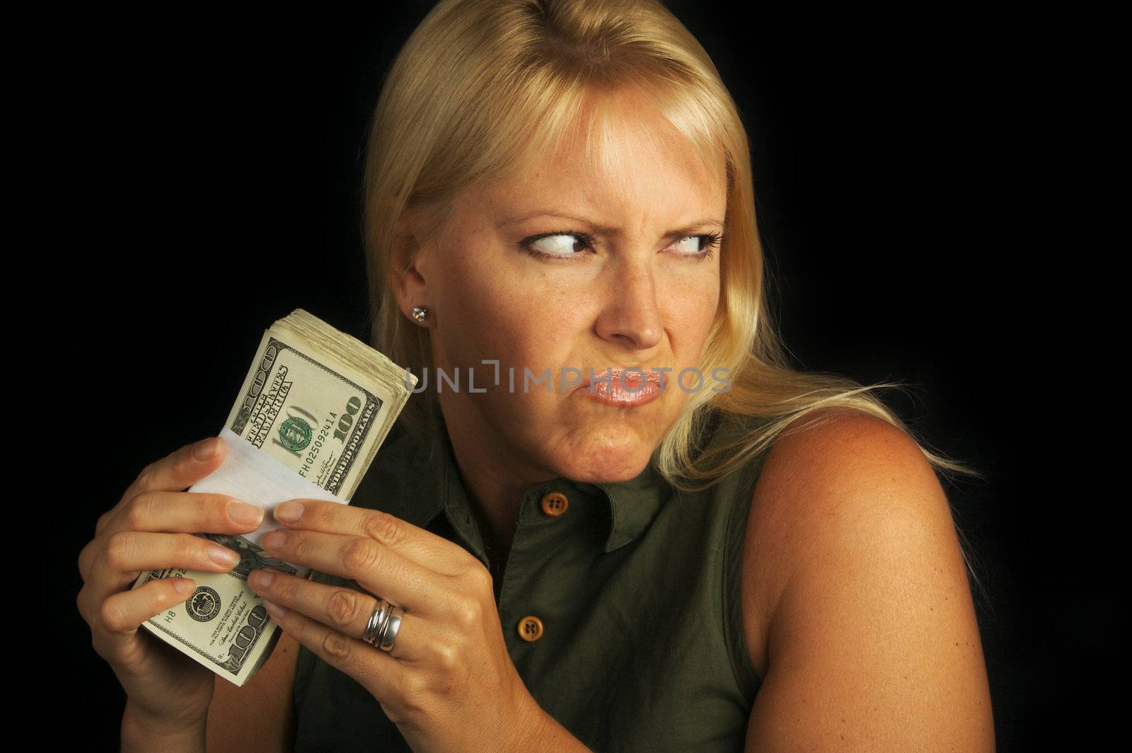 Attractive Woman Gets Greedy About Her Stack of Money