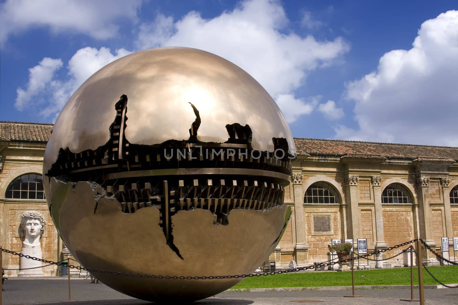 Golden ball in Vatican over blue sky