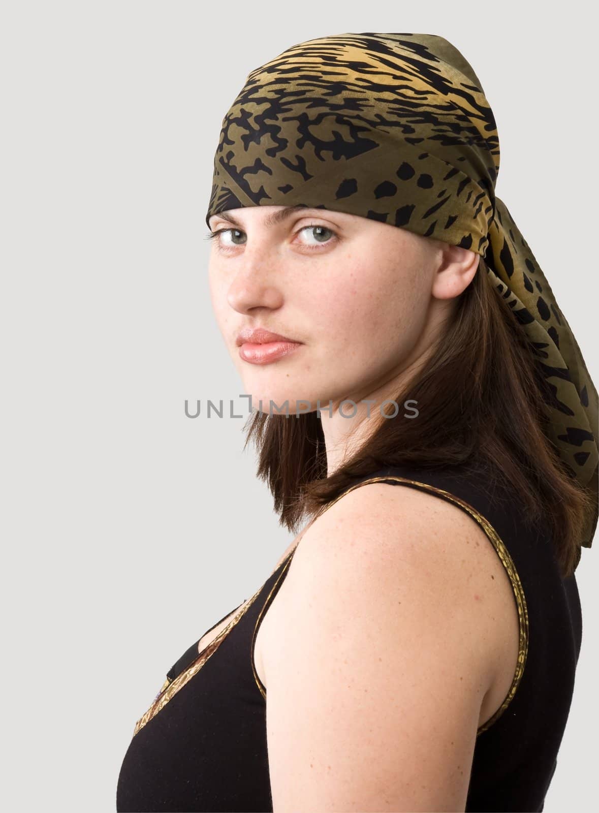 girl in kerchief on a grey background