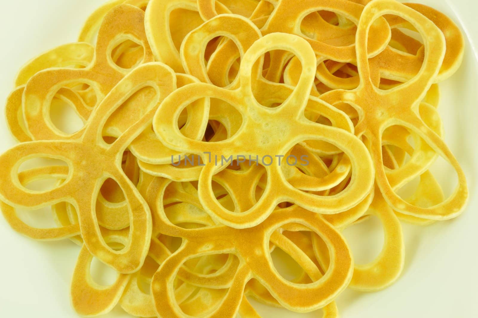 Pancake Flowers Fried from Batter, on White, Close-Up