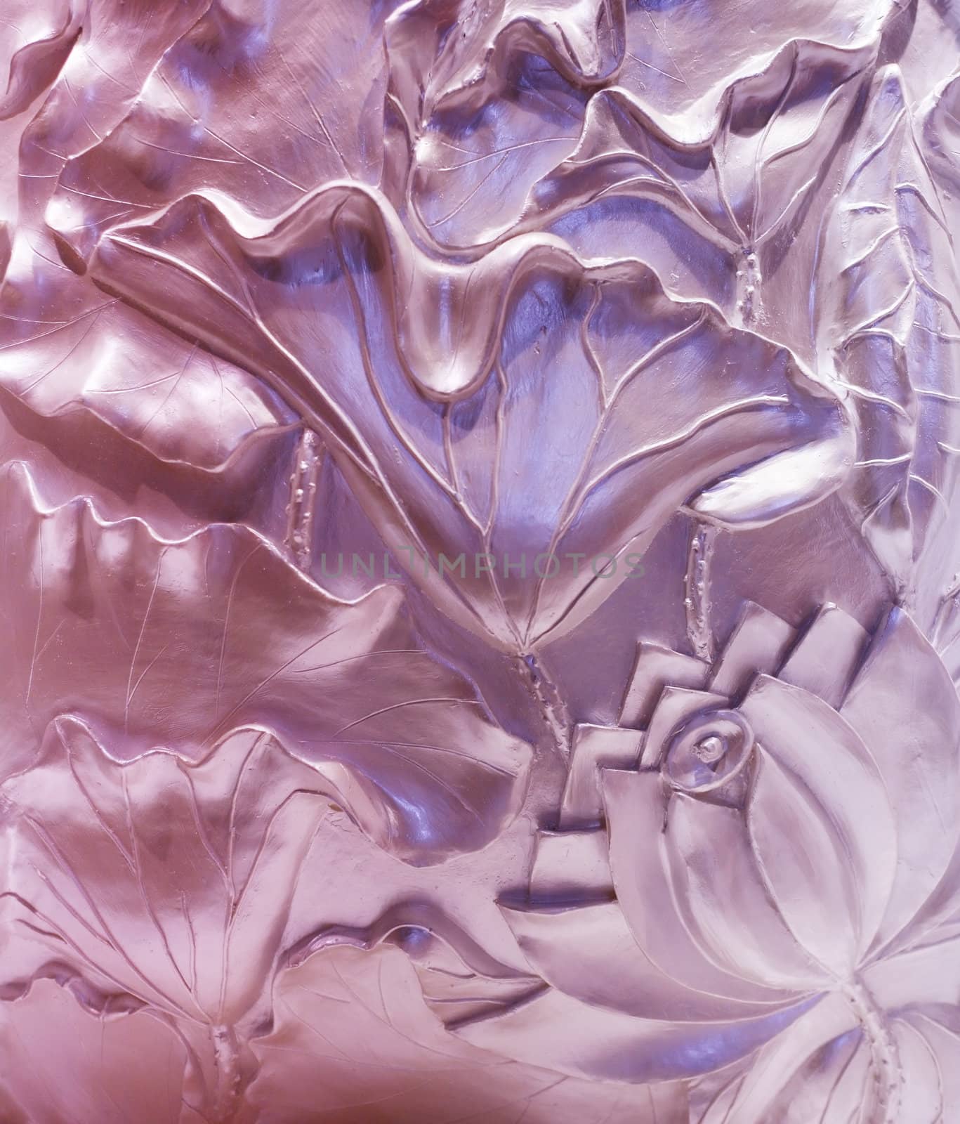 Wall decorated with flowers. Bas-relief