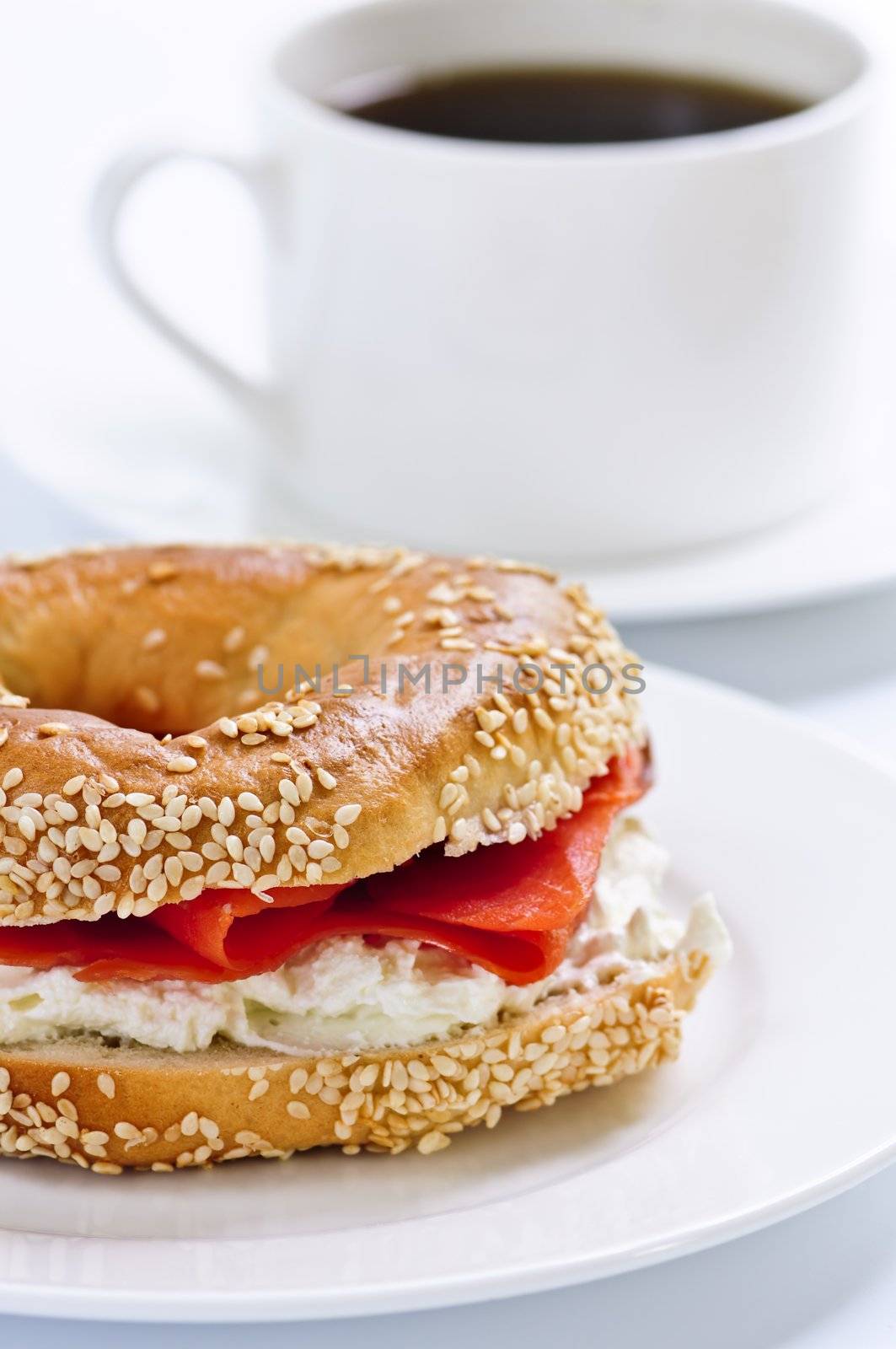 Light meal of smoked salmon bagel and coffee