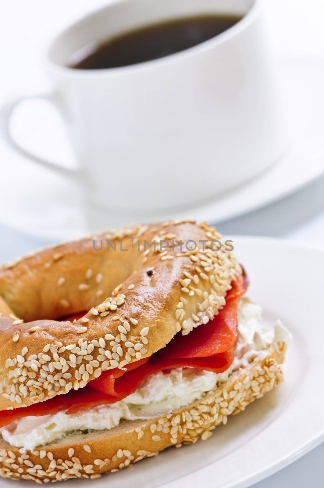 Light meal of smoked salmon bagel and coffee