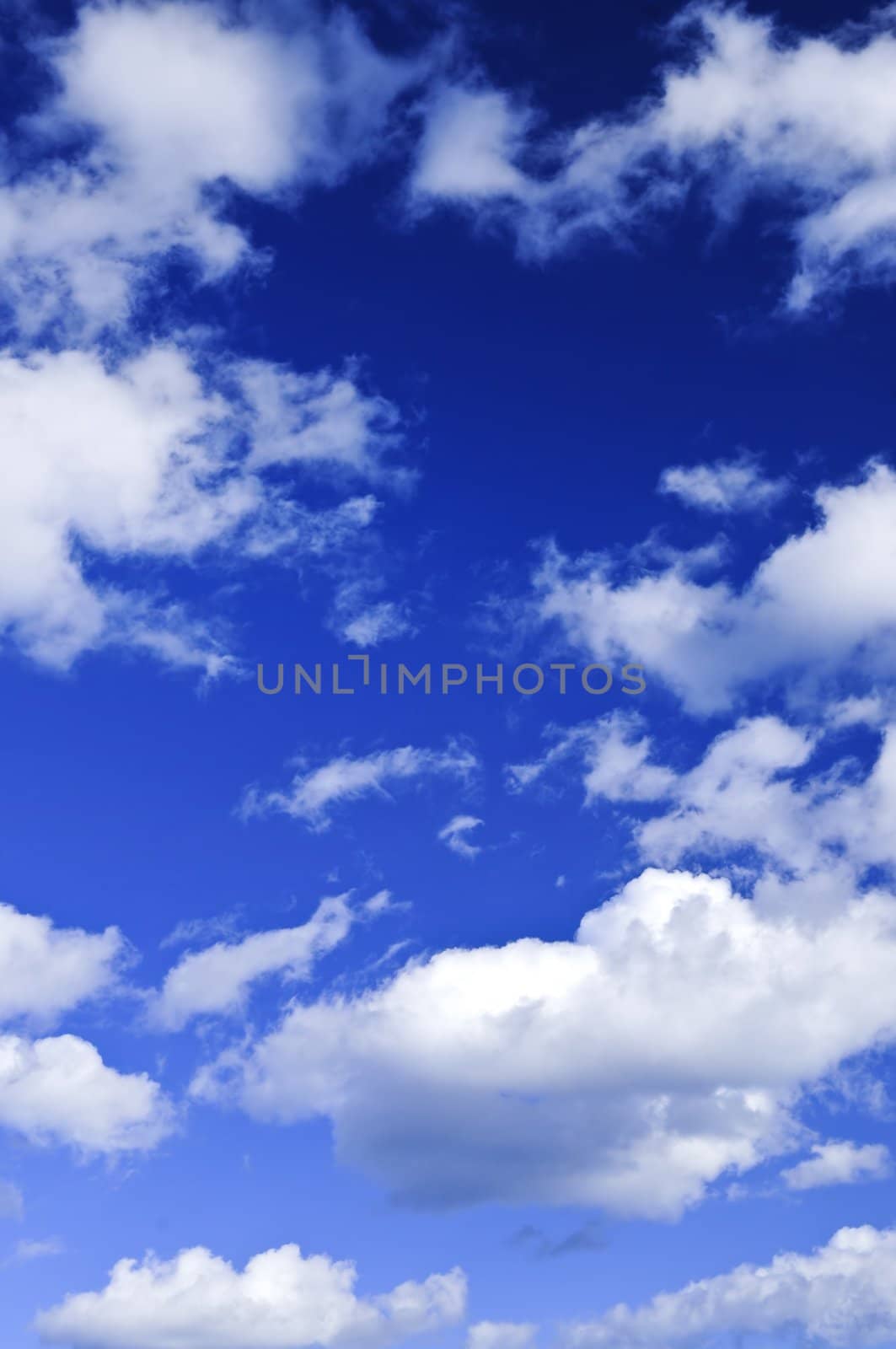 Blue sky with white clouds by elenathewise