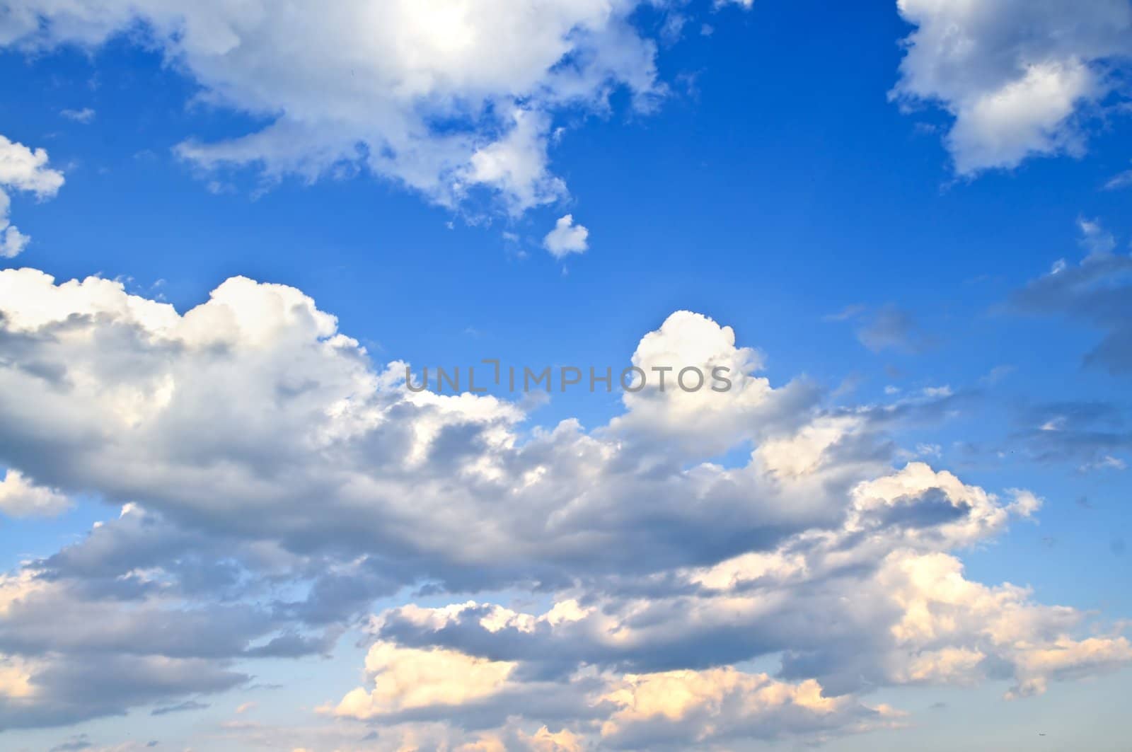 Background of blue sky with white cumulus clouds
