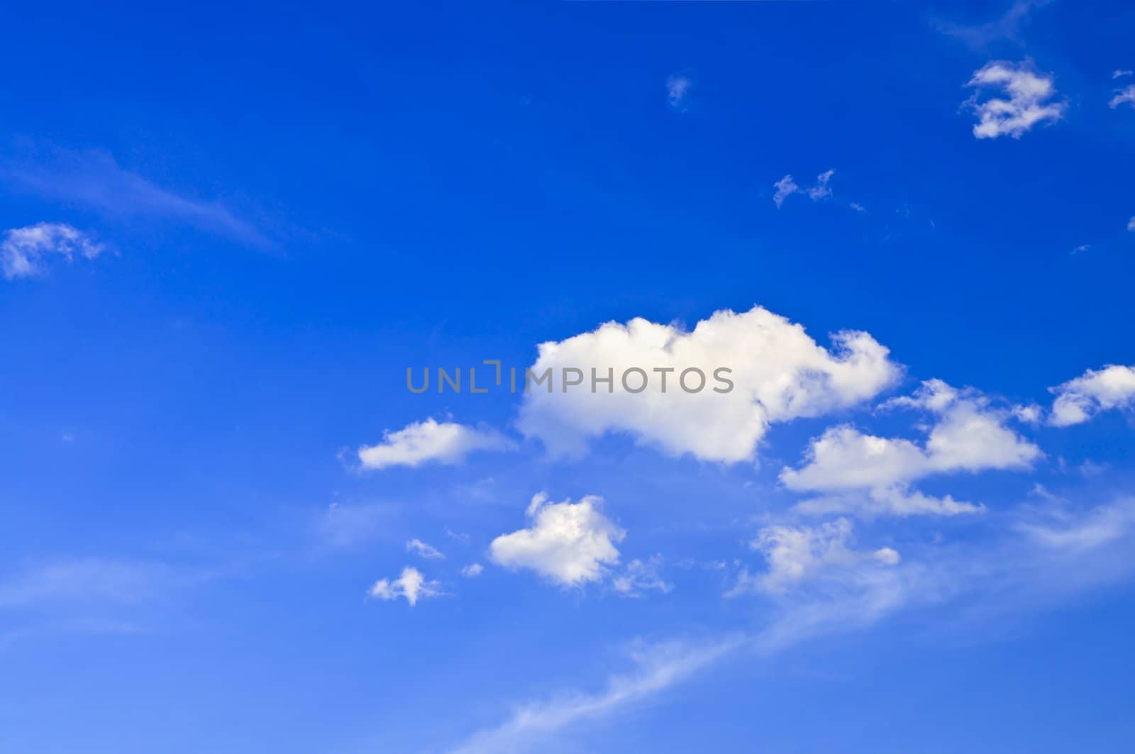 Background of blue sky with white cumulus clouds