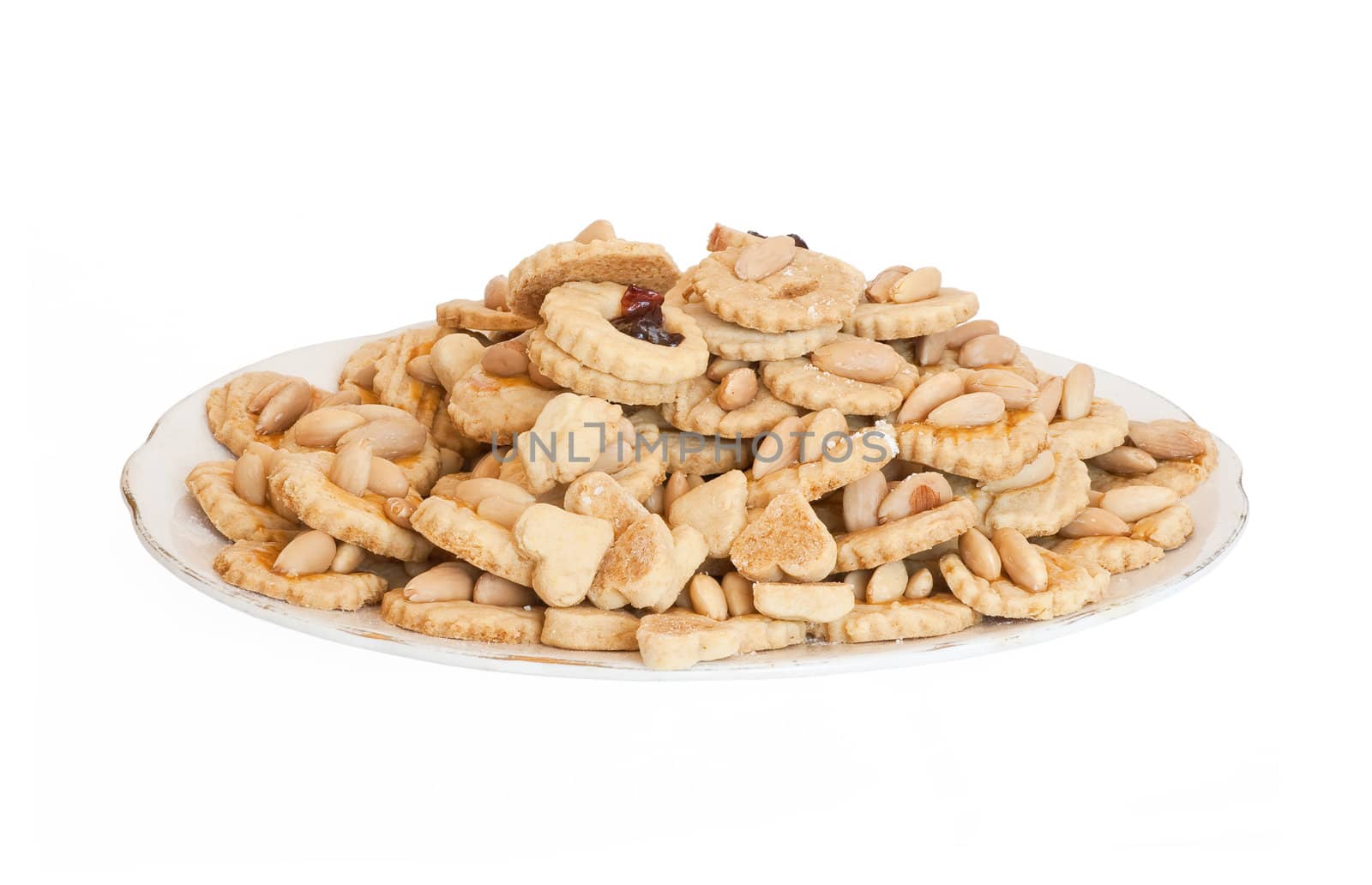 a plate with homemade almond pastries isolated on white background