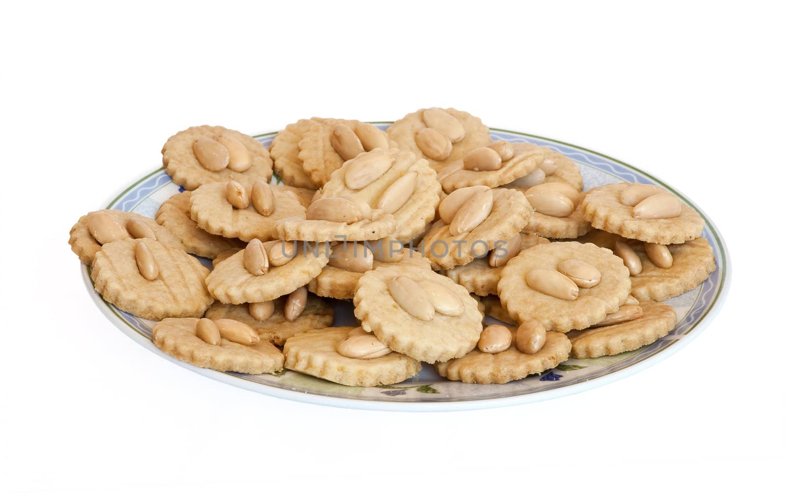 a plate with homemade almond pastries isolated on white background