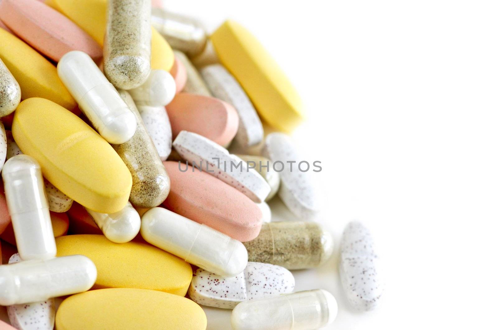 Mix of vitamins and herbal supplements on white background