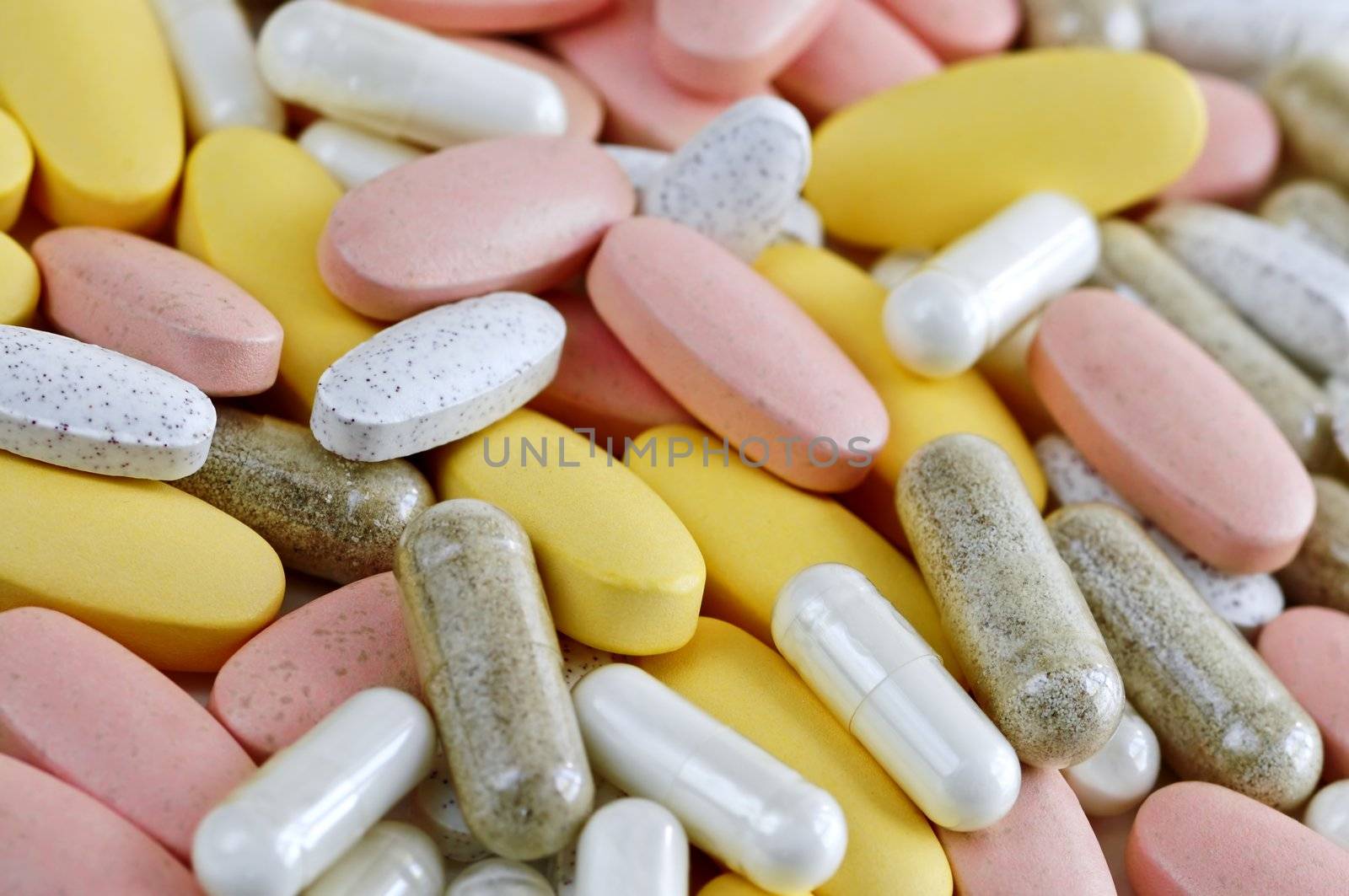Mix of vitamins and herbal supplements close up